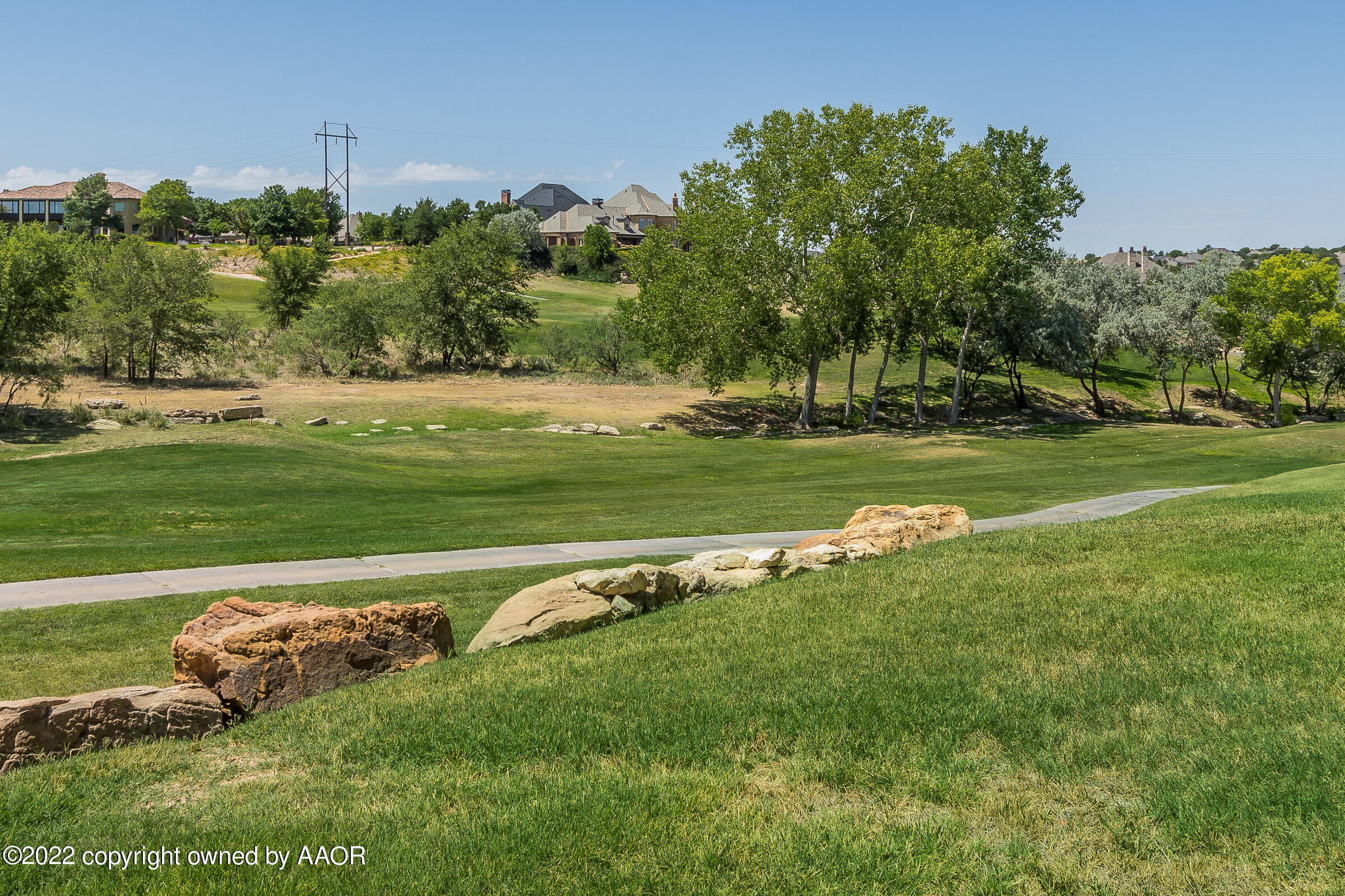 16 Merion Place Amarillo, TX 79124 - Photo 28 of 71 a view of a golf course with a lake