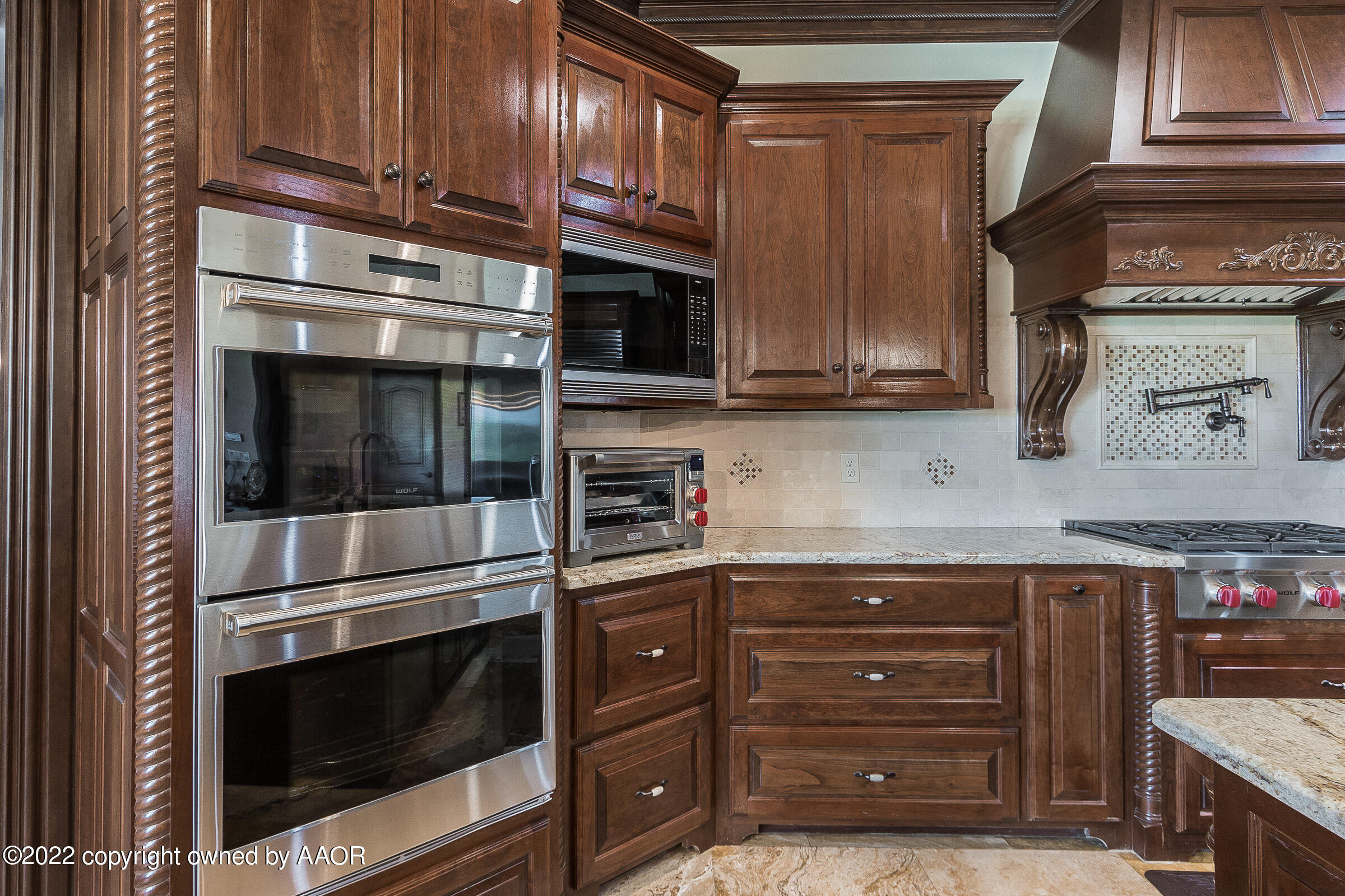 16 Merion Place Amarillo, TX 79124 - Photo 37 of 71 a kitchen with stainless steel appliances granite countertop a stove microwave and cabinets