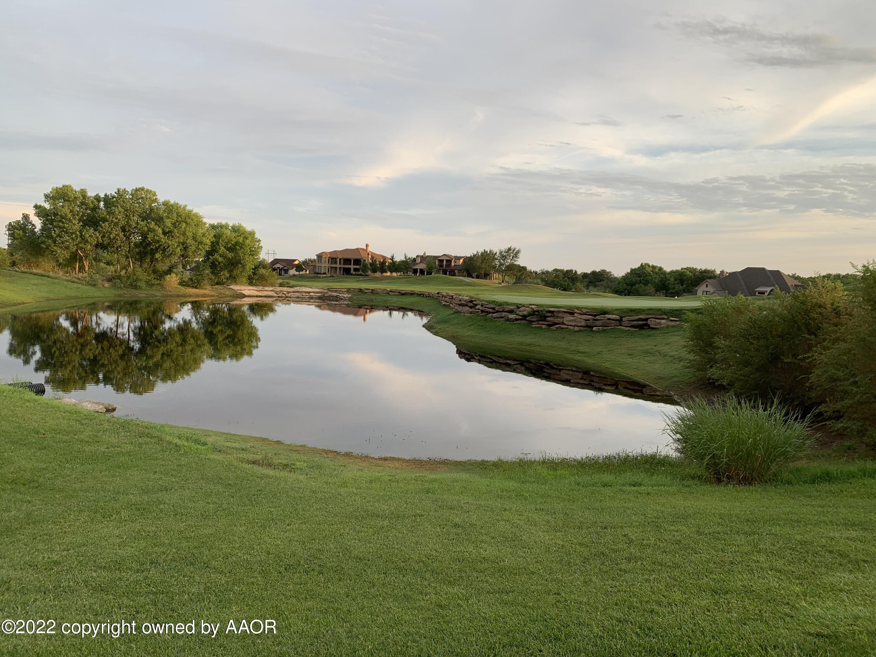 16 Merion Place Amarillo, TX 79124 - Photo 4 of 71 a view of a lake with houses in the back