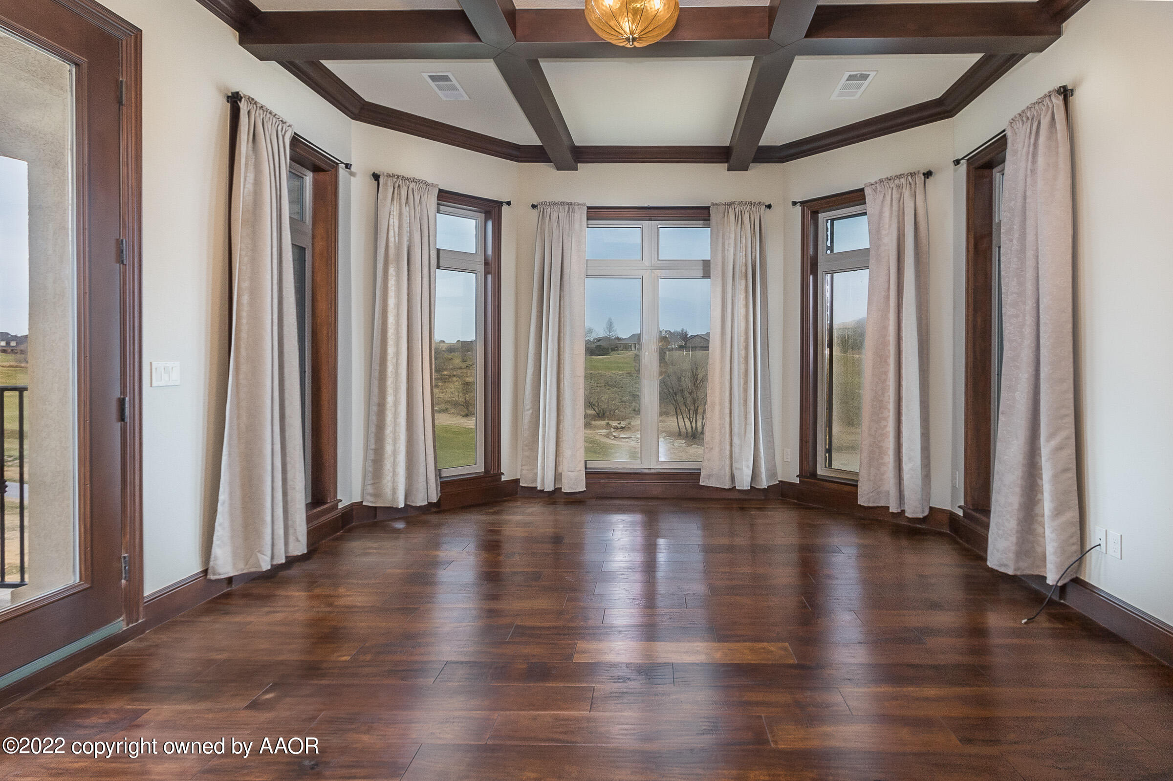 16 Merion Place Amarillo, TX 79124 - Photo 45 of 71 a view of an empty room with wooden floor and a window