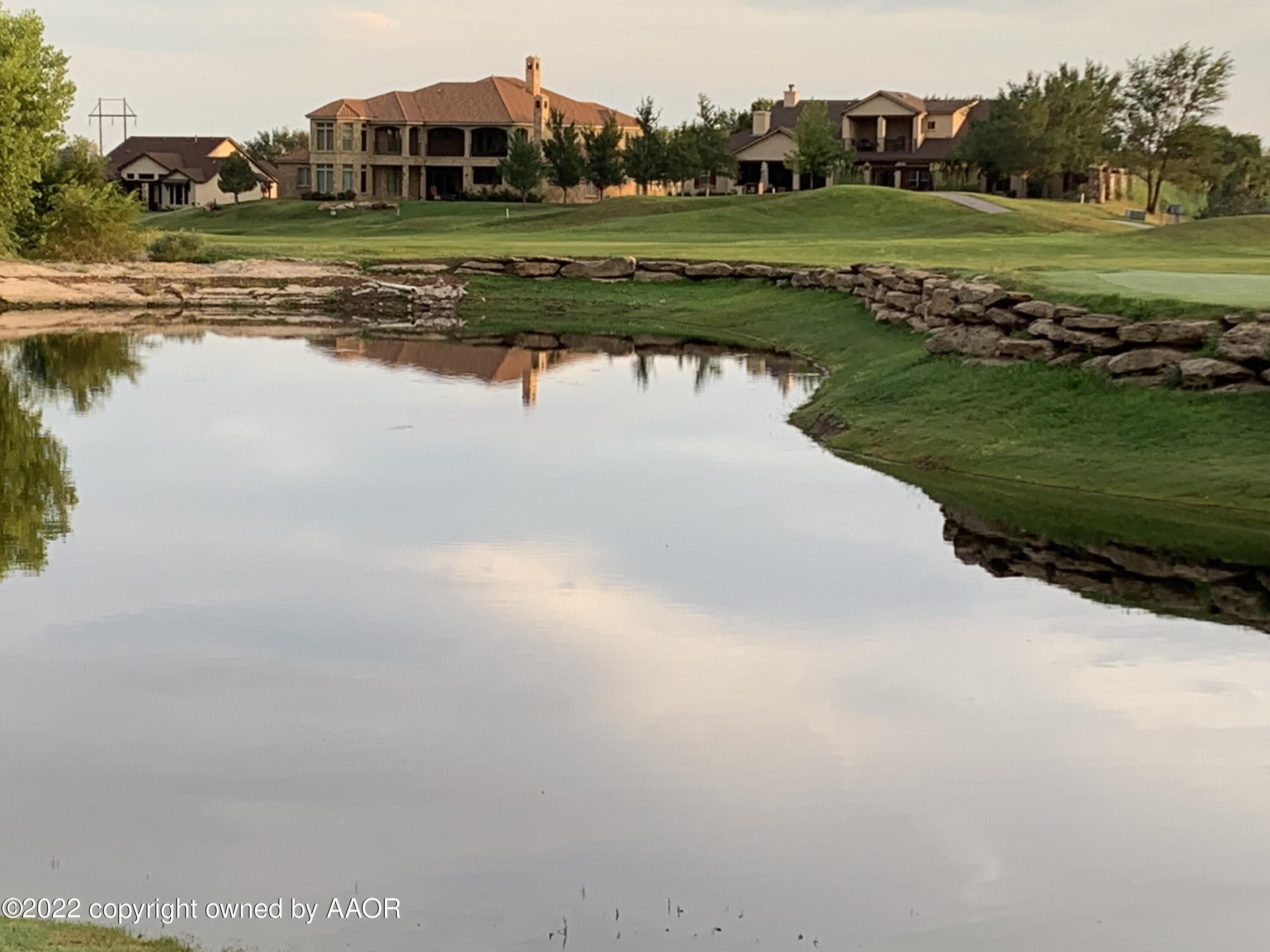 16 Merion Place Amarillo, TX 79124 - Photo 5 of 71 a view of a water pond with green field