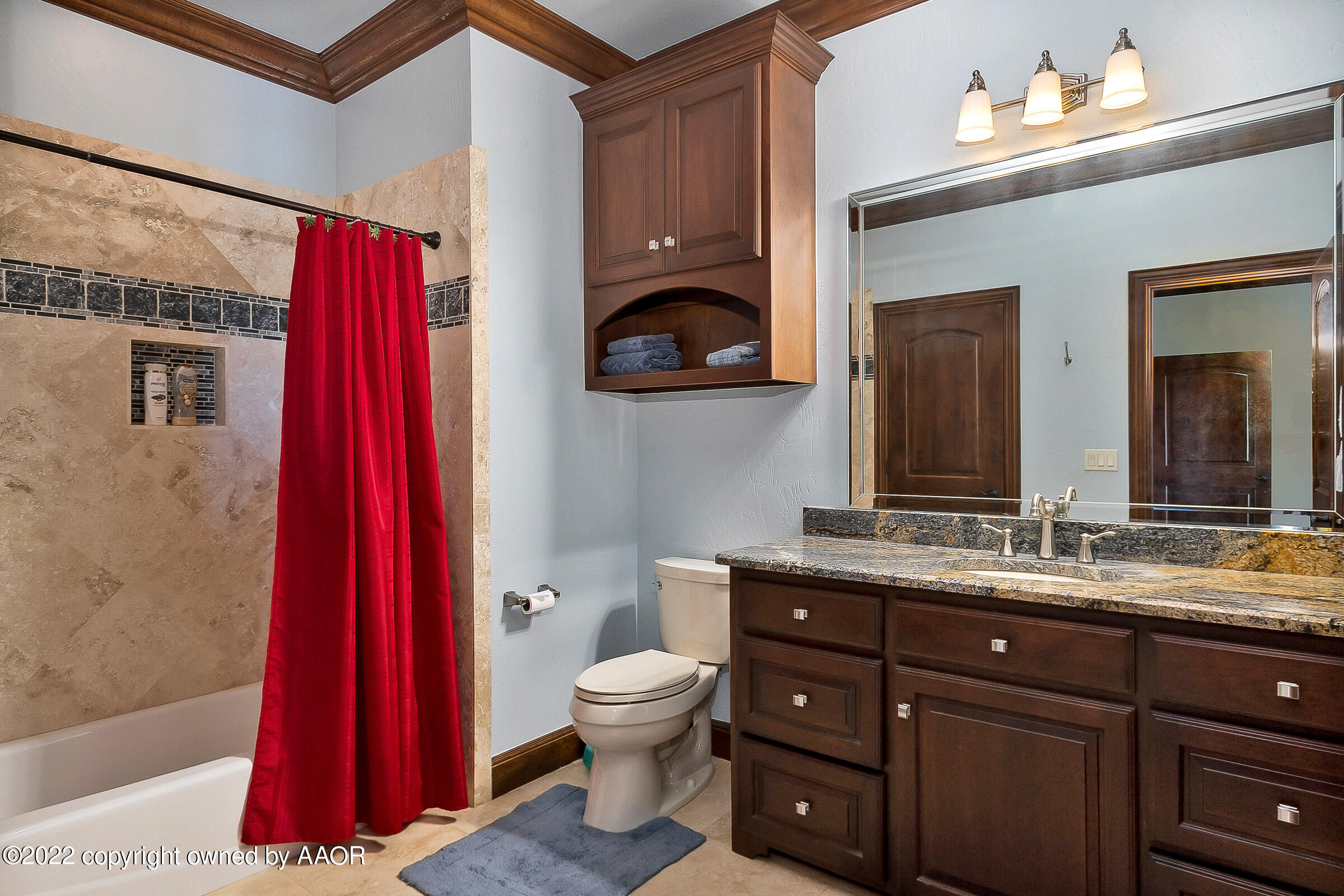 16 Merion Place Amarillo, TX 79124 - Photo 63 of 71 a bathroom with a toilet a sink and a mirror