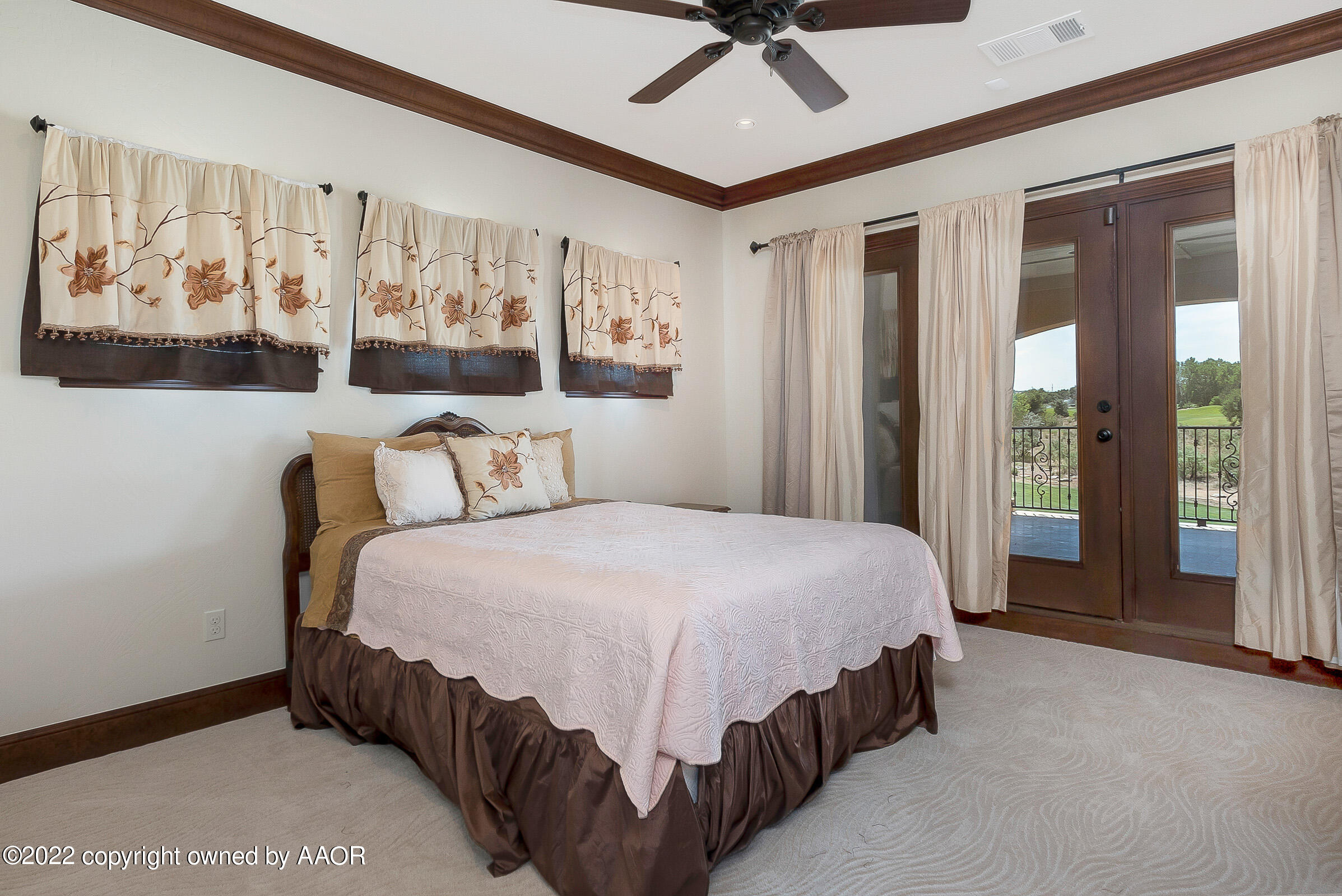 16 Merion Place Amarillo, TX 79124 - Photo 64 of 71 a bedroom with a large bed and a chandelier