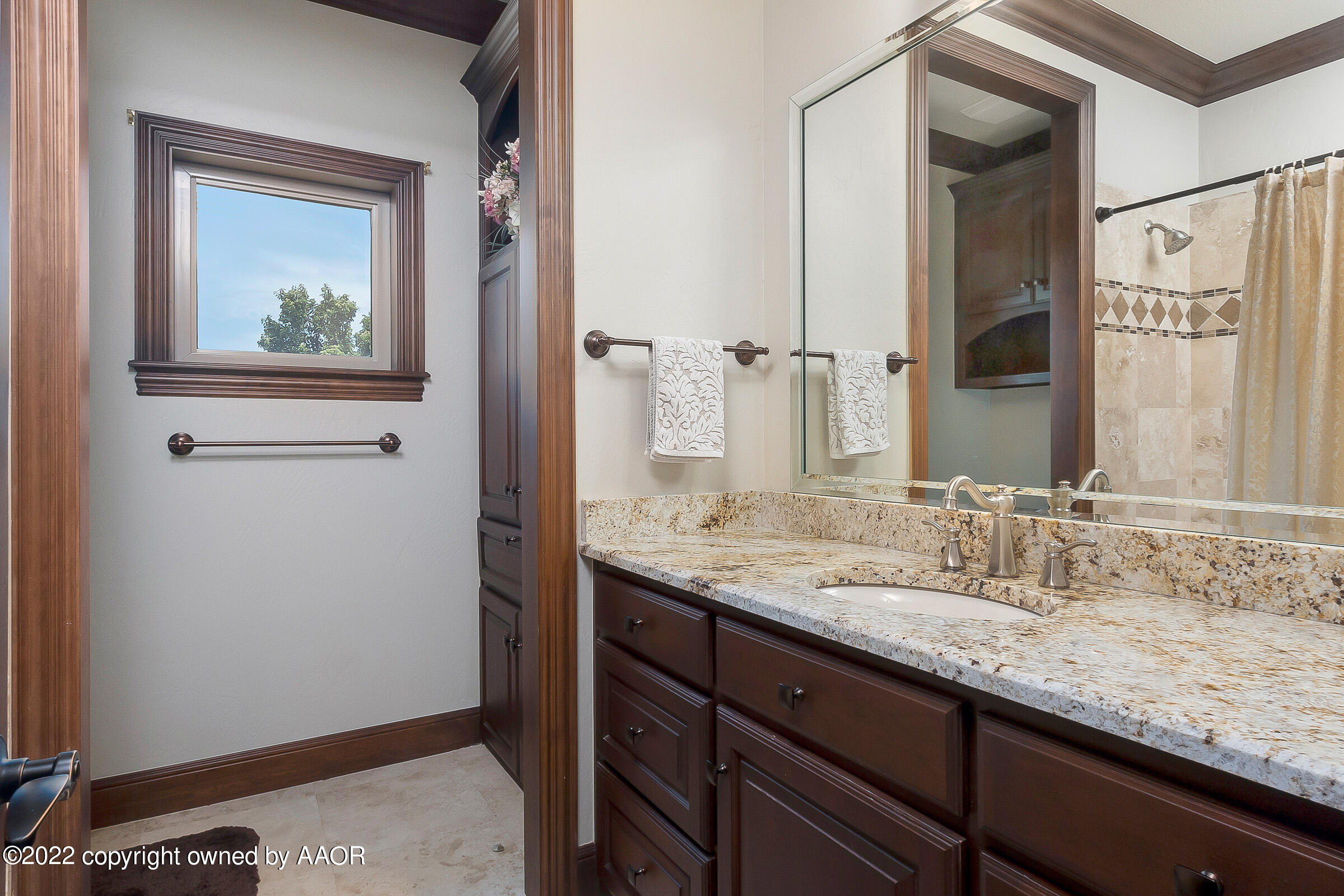 16 Merion Place Amarillo, TX 79124 - Photo 66 of 71 a bathroom with a granite countertop sink and a mirror