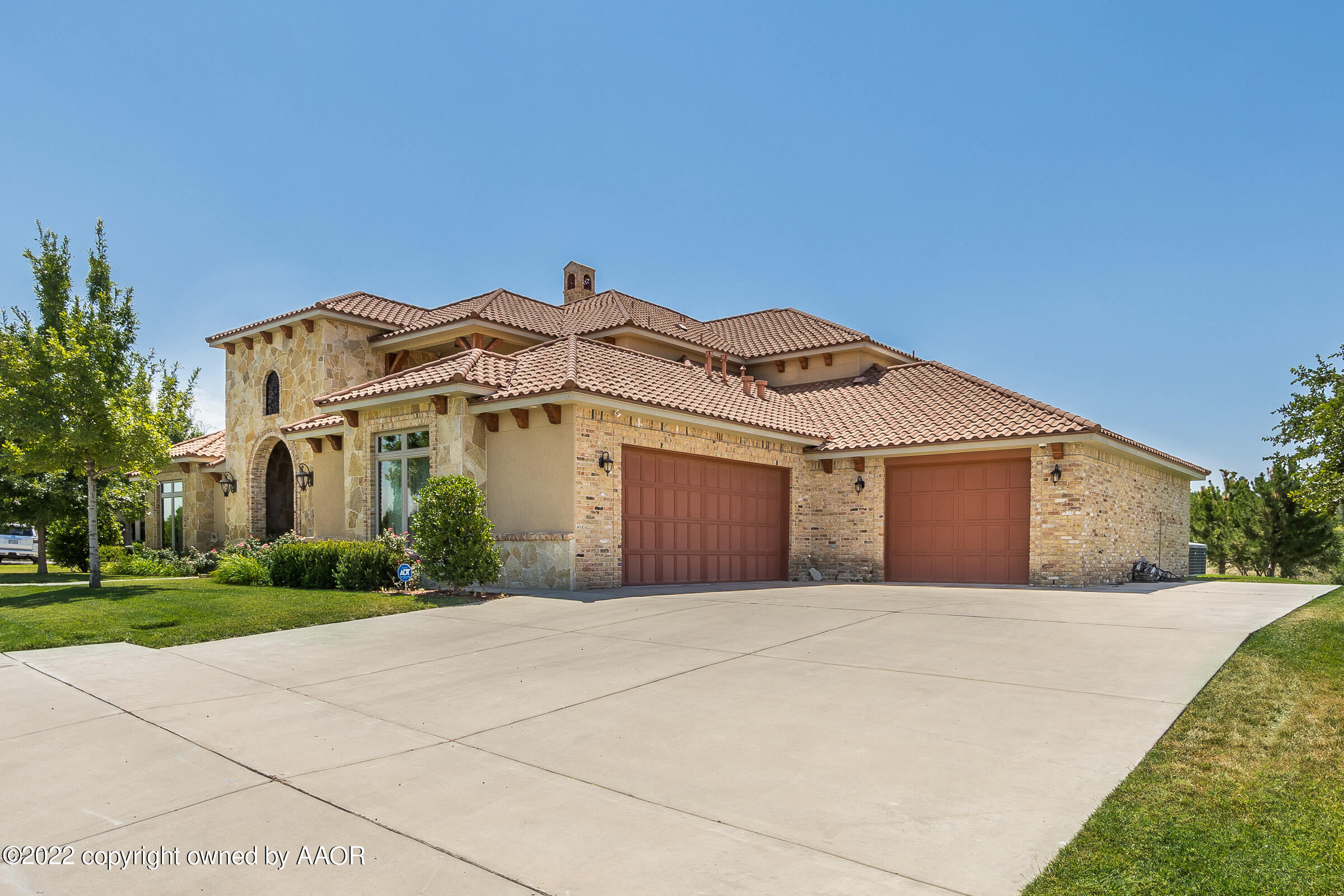 16 Merion Place Amarillo, TX 79124 - Photo 67 of 71 a front view of a house with a garden