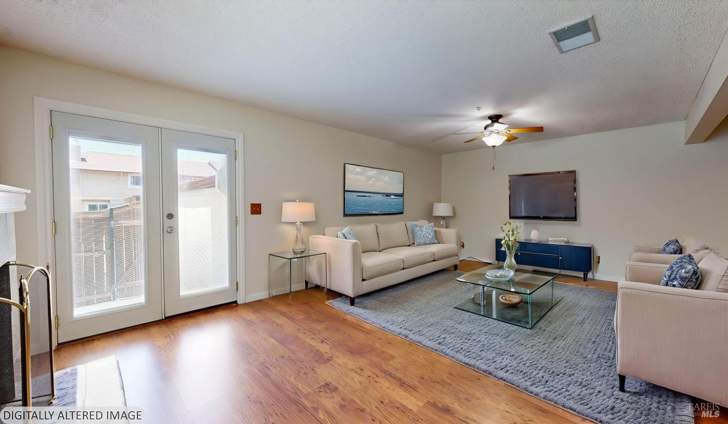 4571 Harbor Lane Rohnert Park, CA 94928 - Photo 6 of 79 a living room with furniture and a flat screen tv