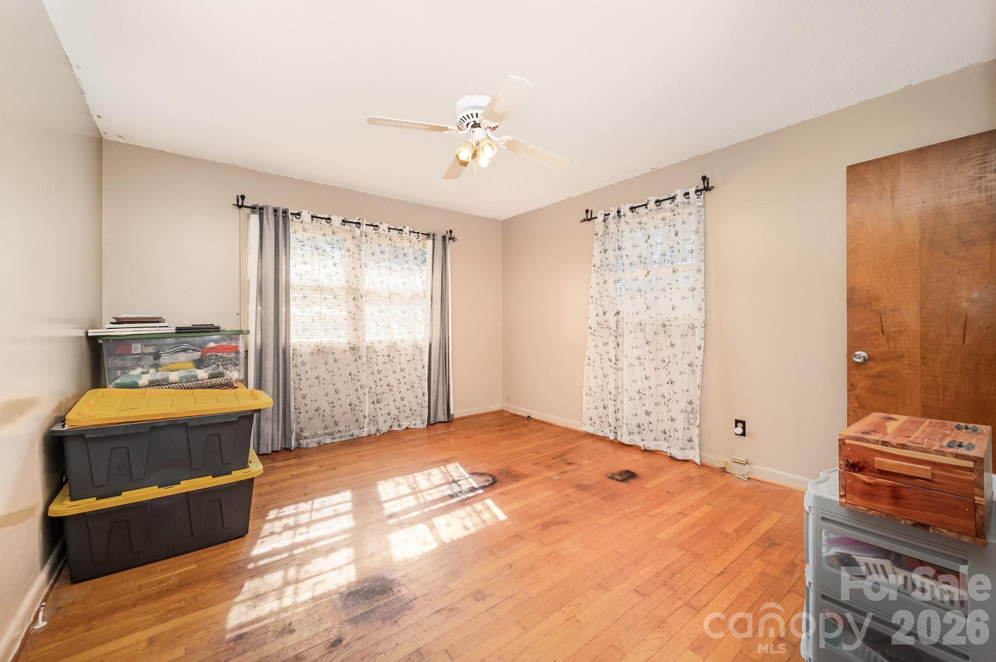 2415 Heavner Road Lincolnton, NC 28092 - Photo 11 of 21 a bedroom with a bed and a chandelier