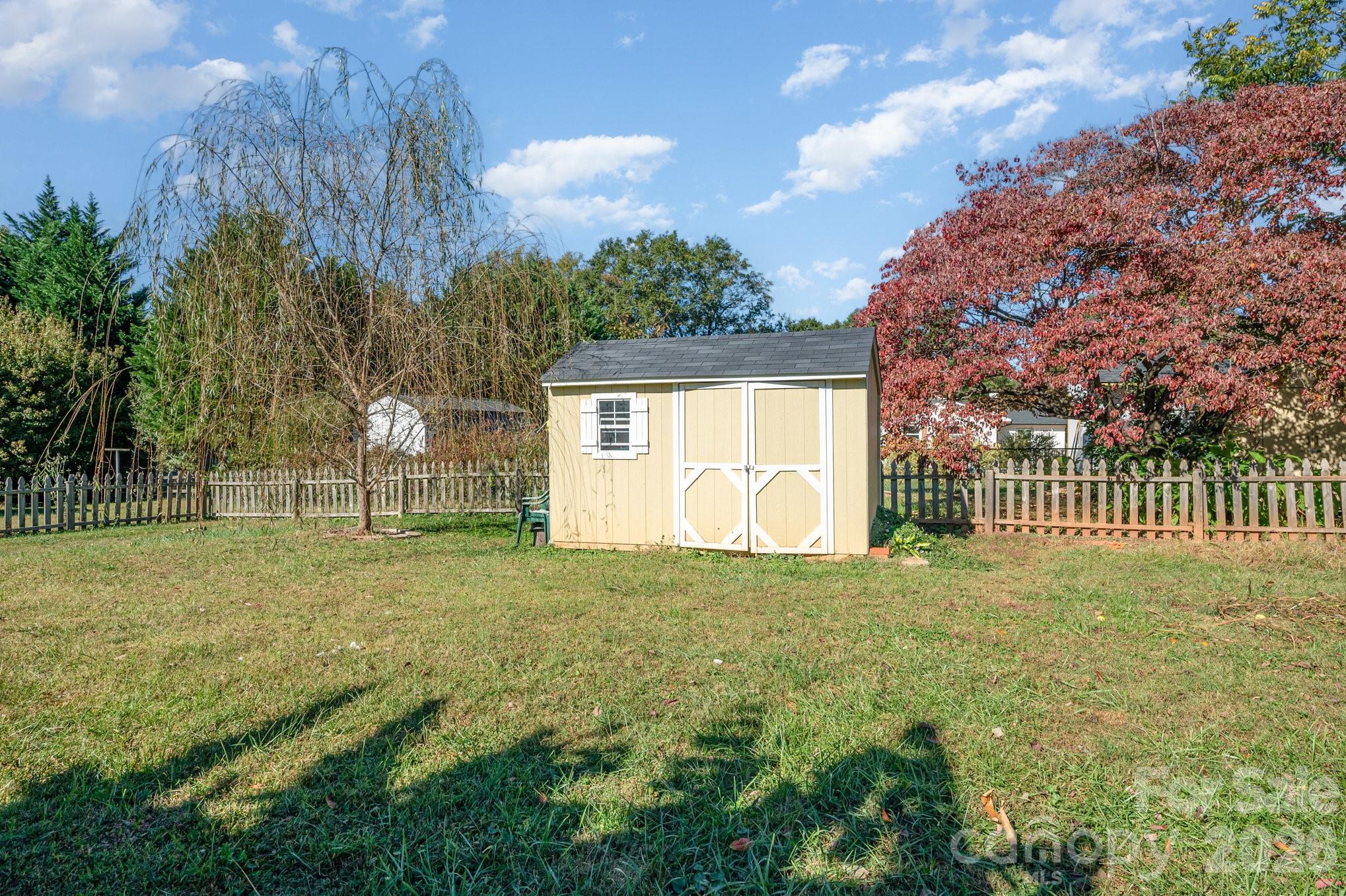 2415 Heavner Road Lincolnton, NC 28092 - Photo 20 of 21 a view of a yard with a house in the background