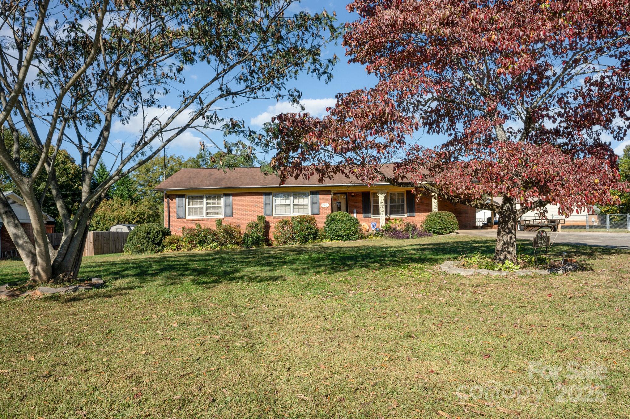 2415 Heavner Road Lincolnton, NC 28092 - Photo 20 of 21 a front view of a house with a garden