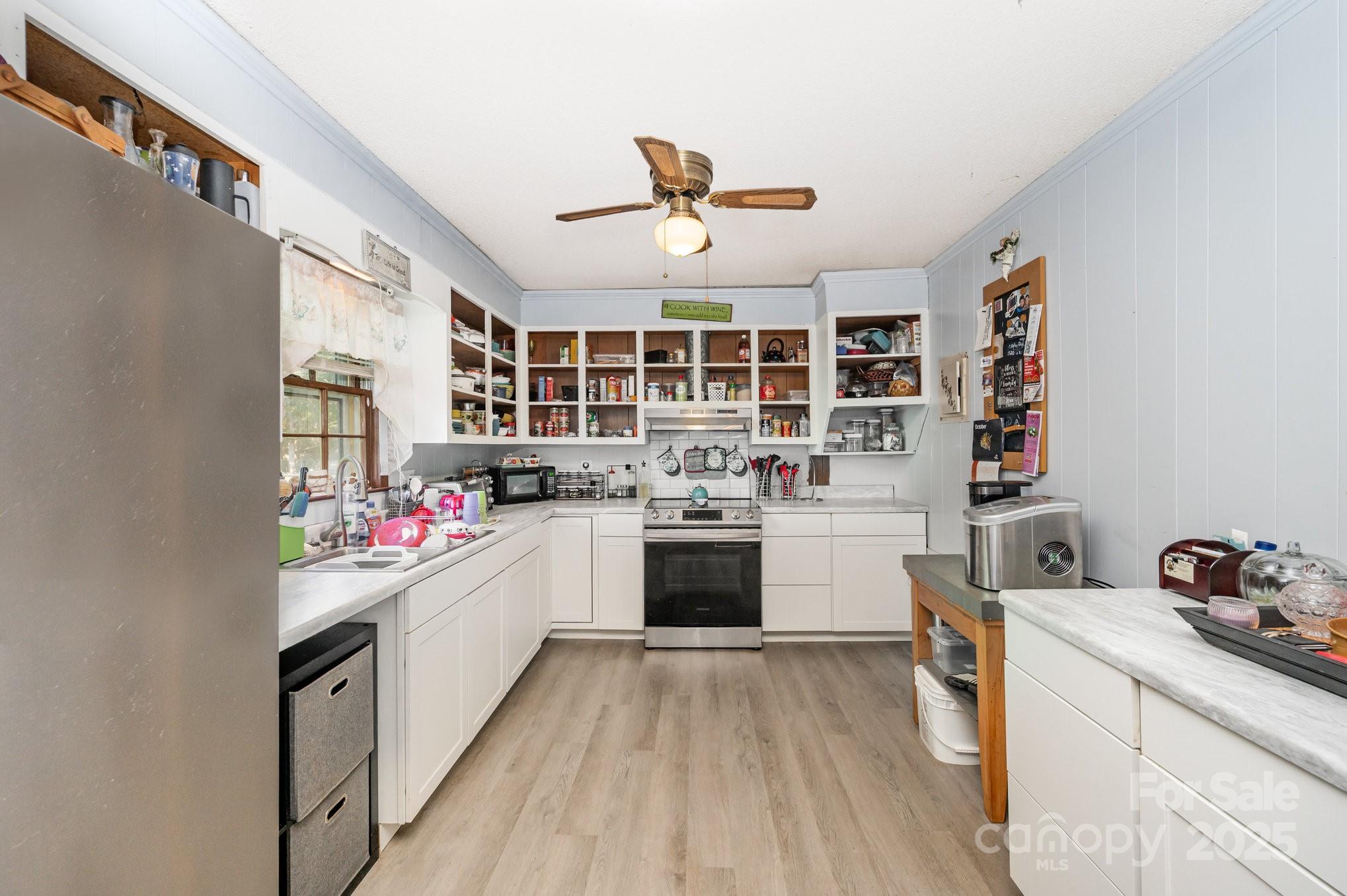 2415 Heavner Road Lincolnton, NC 28092 - Photo 5 of 21 a kitchen with a sink cabinets and window