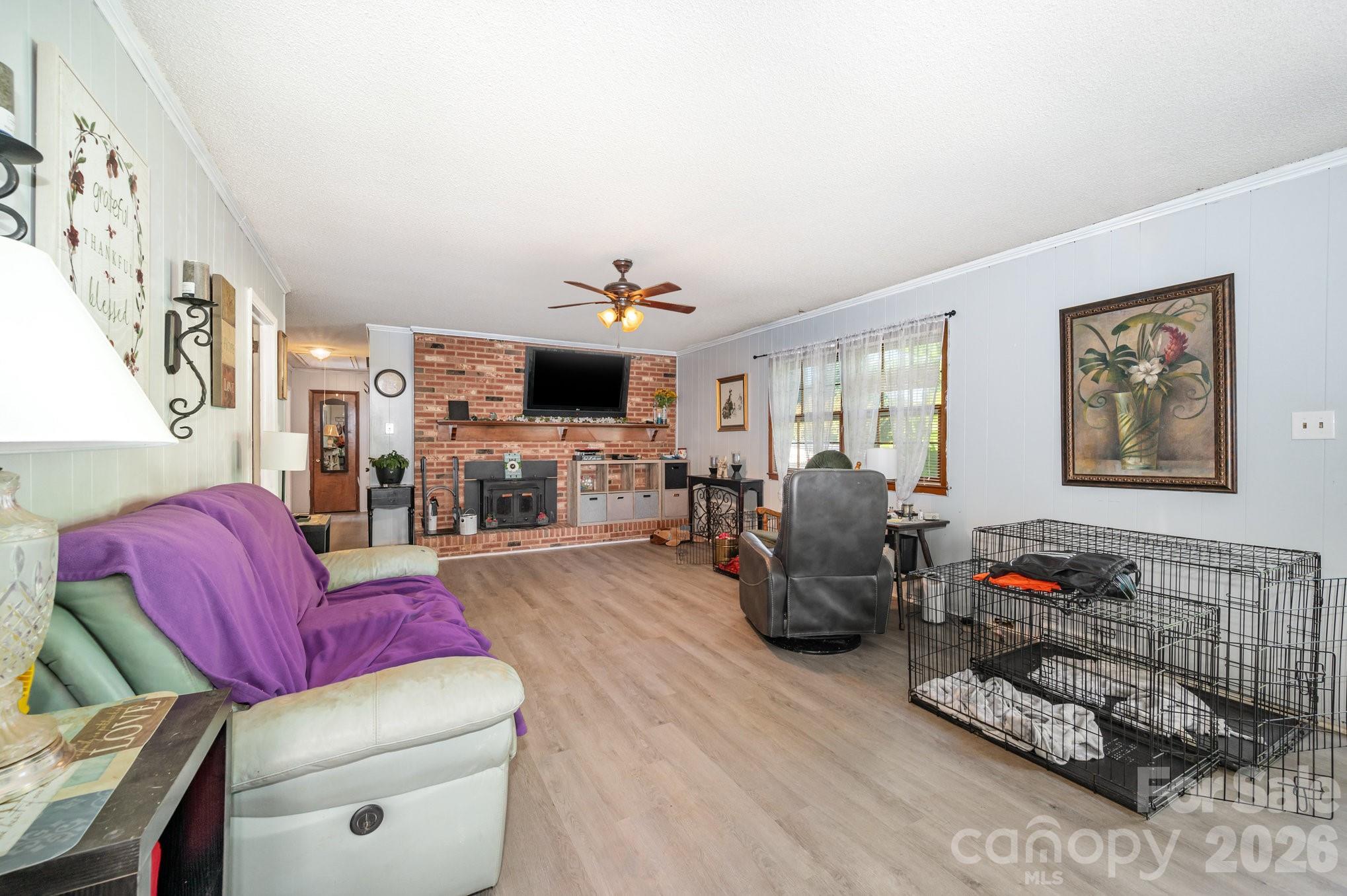 2415 Heavner Road Lincolnton, NC 28092 - Photo 6 of 21 a living room with furniture and a flat screen tv