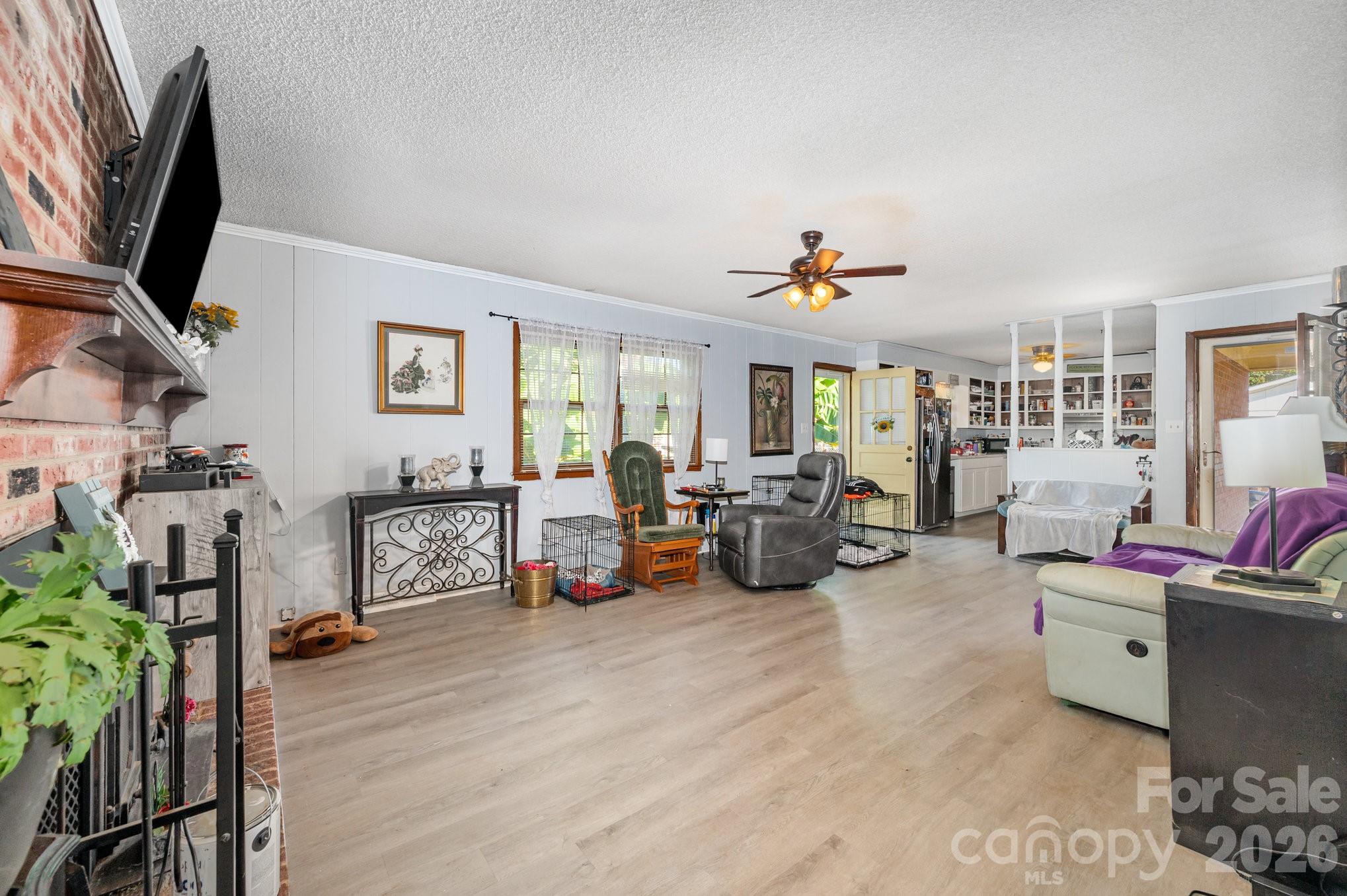 2415 Heavner Road Lincolnton, NC 28092 - Photo 7 of 21 a living room with furniture and a flat screen tv