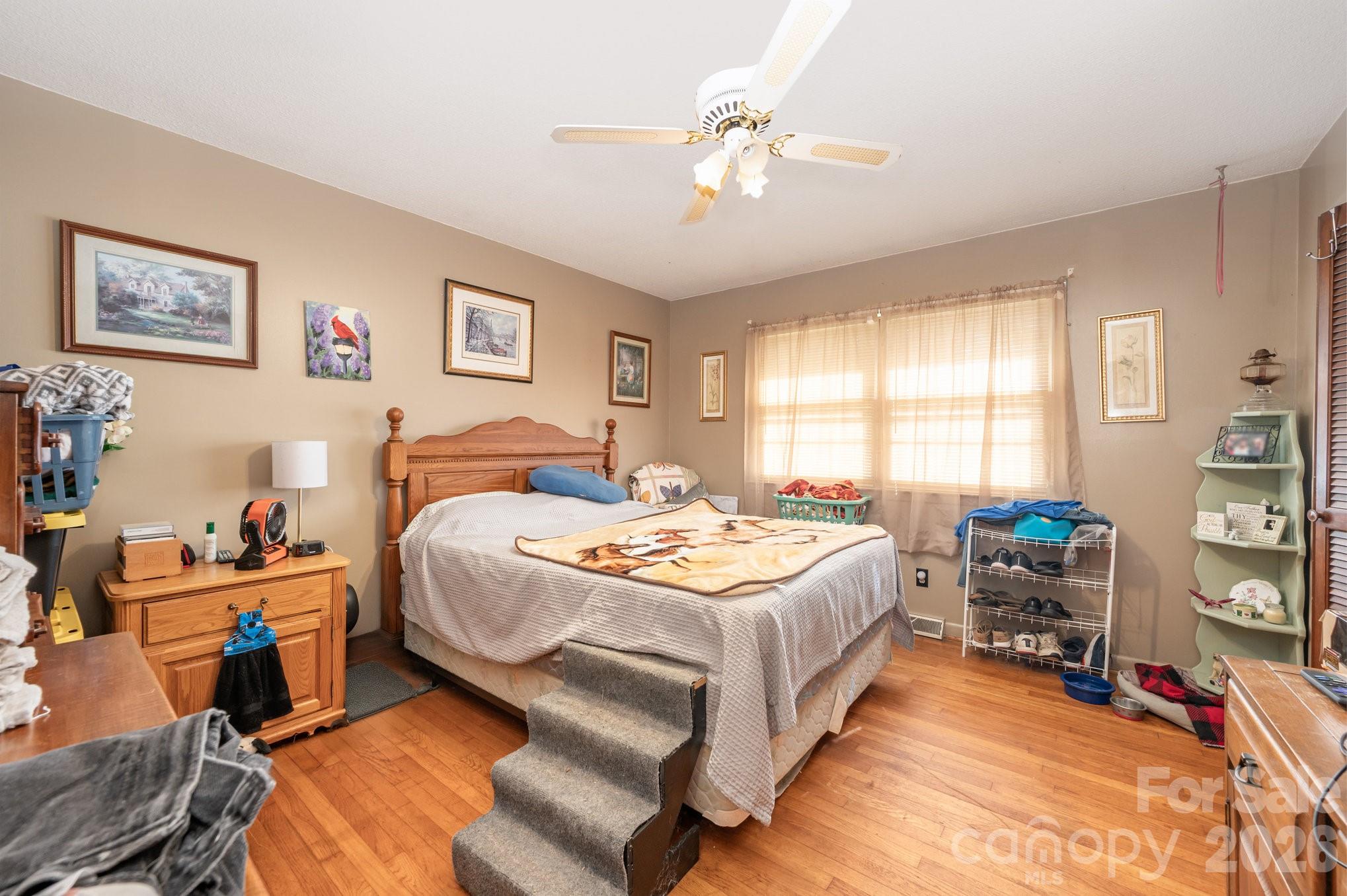 2415 Heavner Road Lincolnton, NC 28092 - Photo 8 of 21 a bedroom with a bed a table and chair