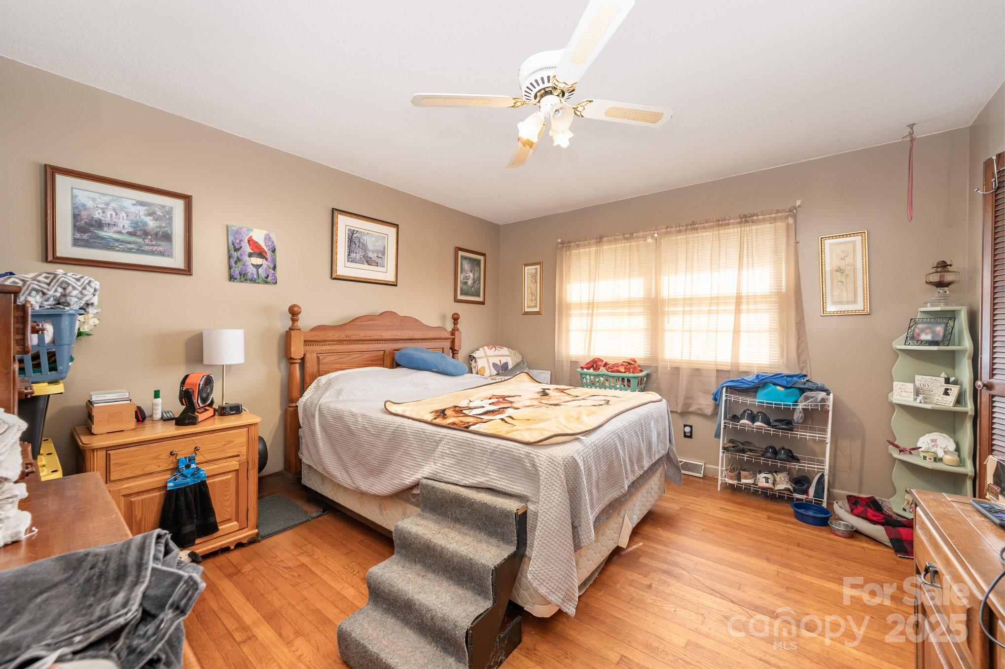 2415 Heavner Road Lincolnton, NC 28092 - Photo 8 of 21 a bedroom with a bed a table and chair