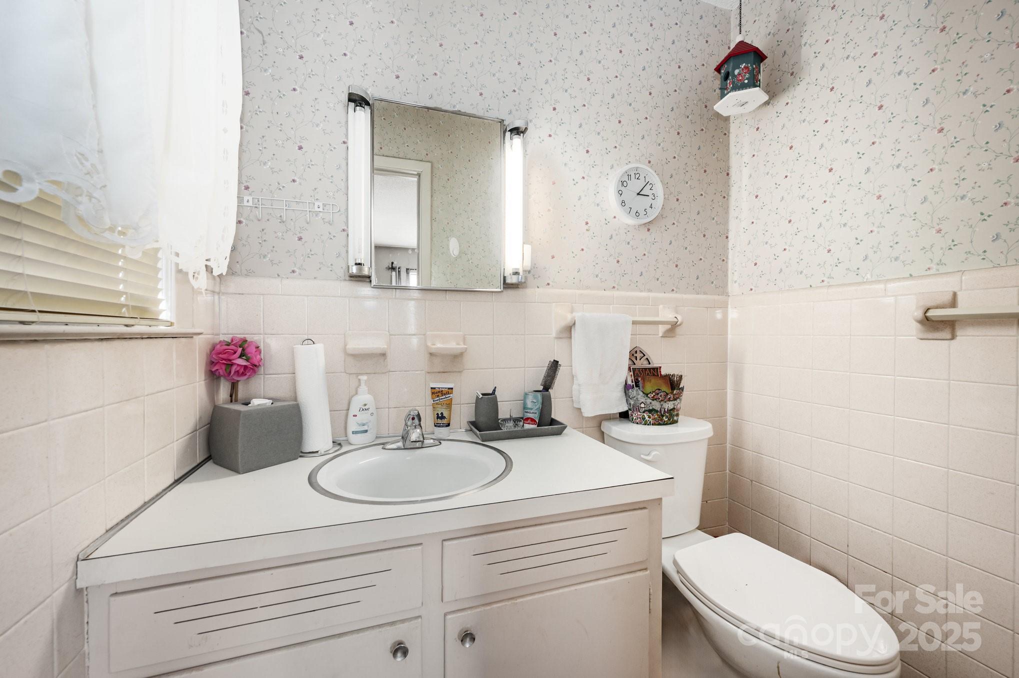 2415 Heavner Road Lincolnton, NC 28092 - Photo 10 of 21 a bathroom with a sink vanity mirror and toilet