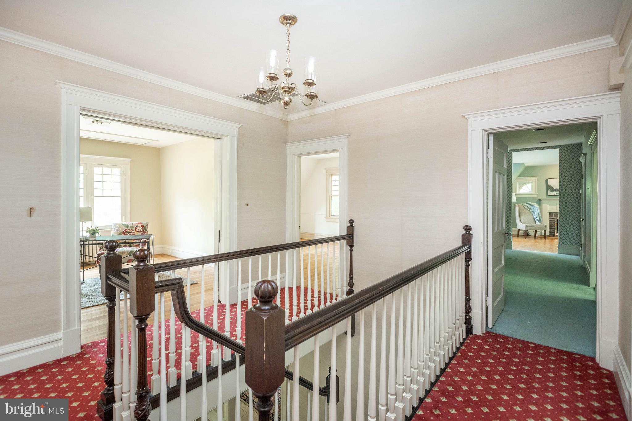 403 Club Road Baltimore, MD 21210 - Photo 31 of 72 a view of a hallway with wooden floor and stairs