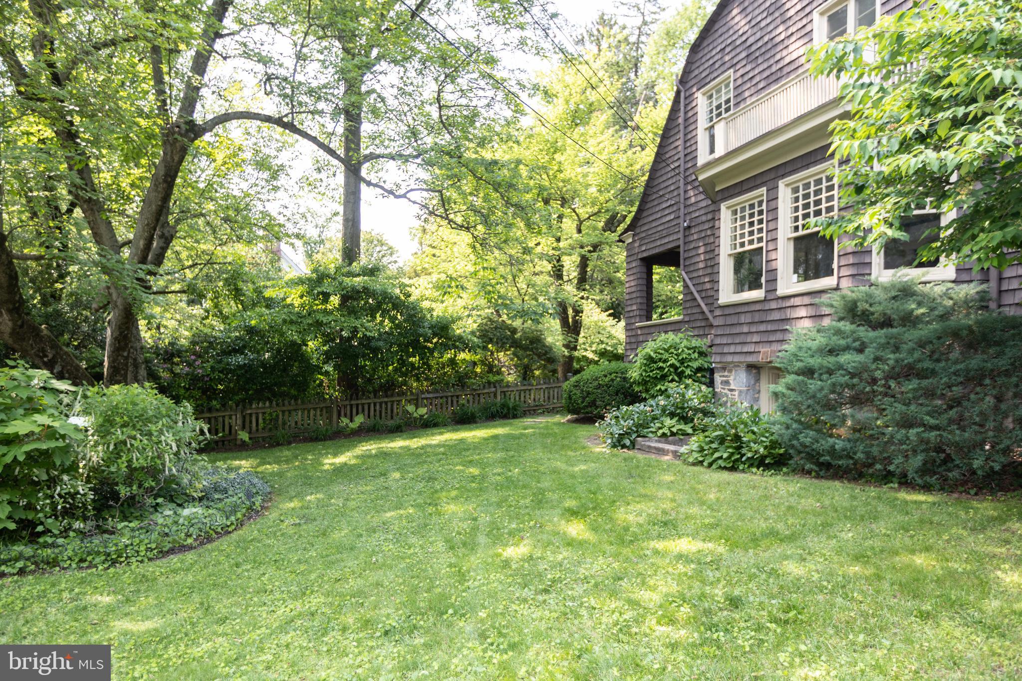 403 Club Road Baltimore, MD 21210 - Photo 59 of 72 a view of a backyard with plants and large trees