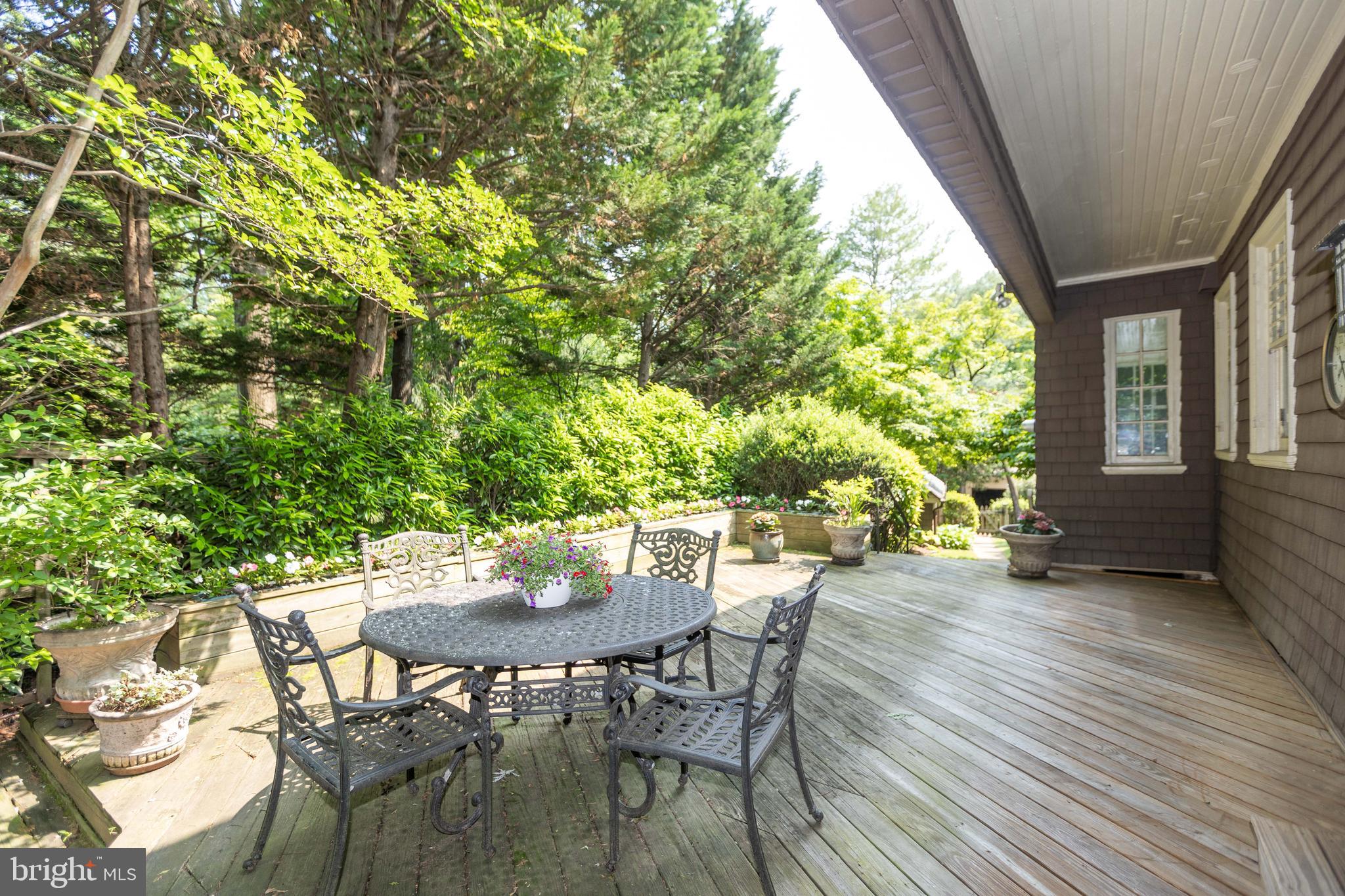 403 Club Road Baltimore, MD 21210 - Photo 67 of 72 a view of a patio with a table and chairs and potted plants