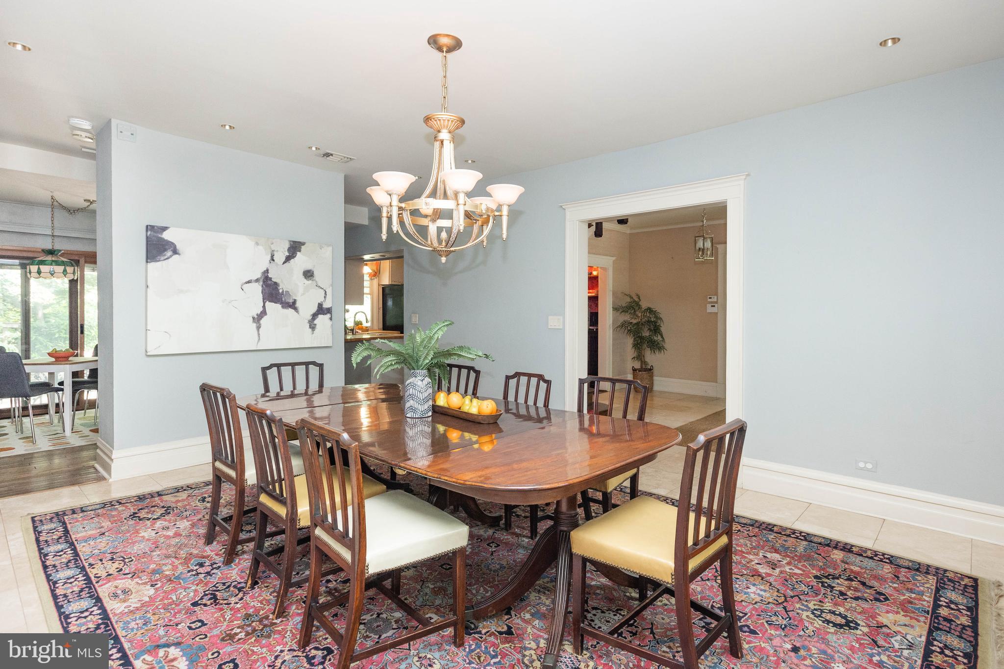 403 Club Road Baltimore, MD 21210 - Photo 10 of 72 a view of a dining room with furniture a chandelier and wooden floor