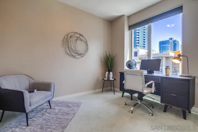 a workspace with furniture and a window