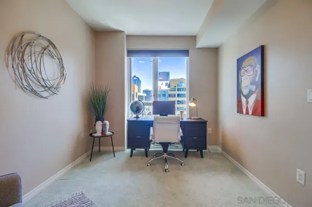 a dining room with furniture and window