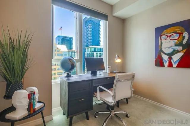 a workspace with furniture and window