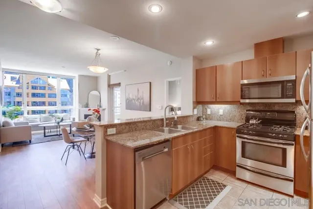 a kitchen with a sink stove and microwave