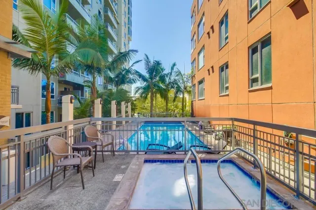 a view of a backyard with plants and a patio
