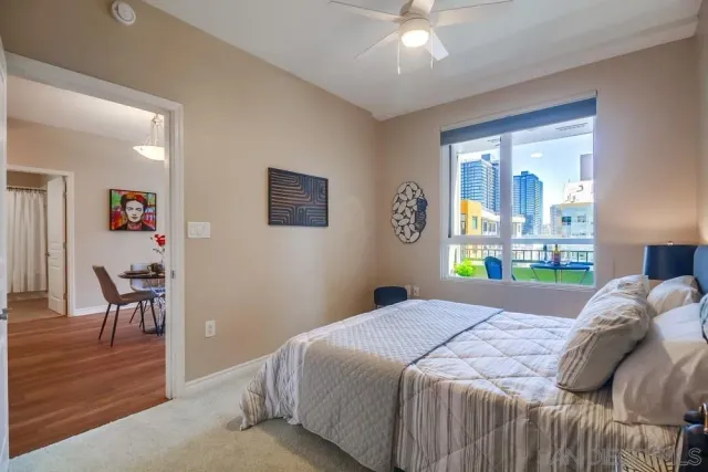 a bedroom with a bed and a table