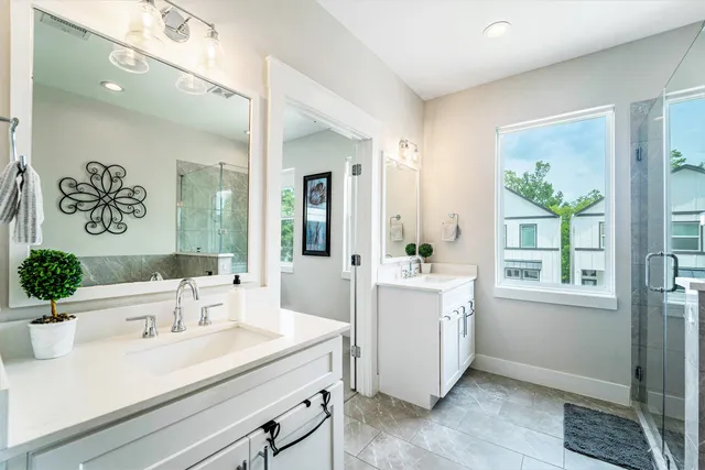 a view of bathroom with dual sinks