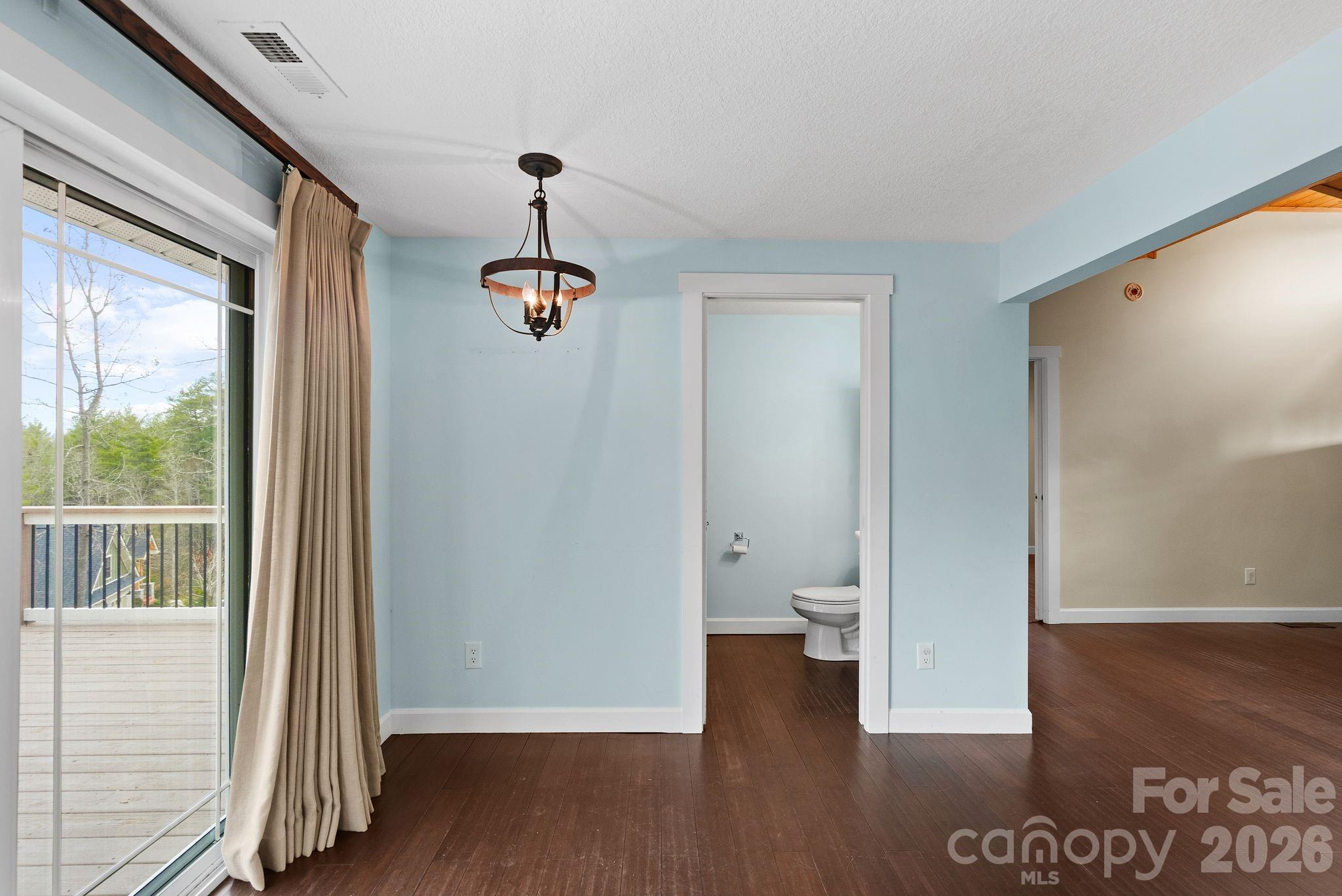 90 Palmer Ford Road Weaverville, NC 28787 - Photo 15 of 32 a view of a hallway with wooden floor and a bathroom