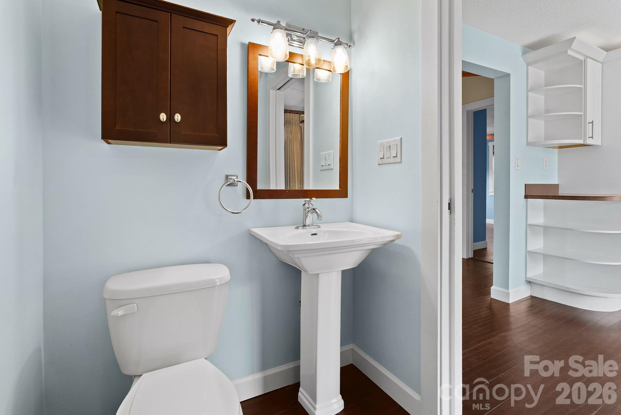 90 Palmer Ford Road Weaverville, NC 28787 - Photo 16 of 32 a bathroom with a toilet sink and mirror