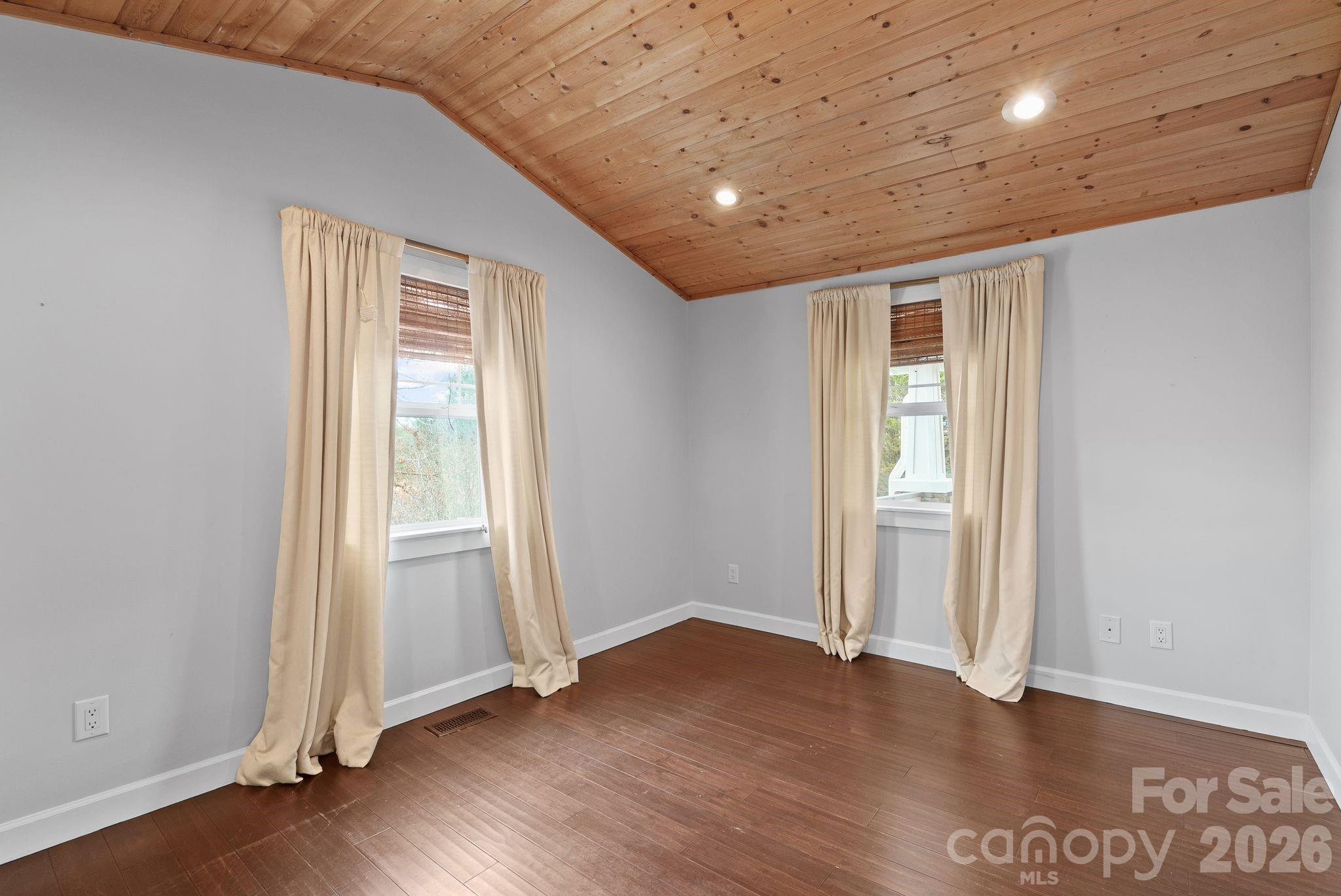 90 Palmer Ford Road Weaverville, NC 28787 - Photo 19 of 32 an empty room with wooden floor and windows