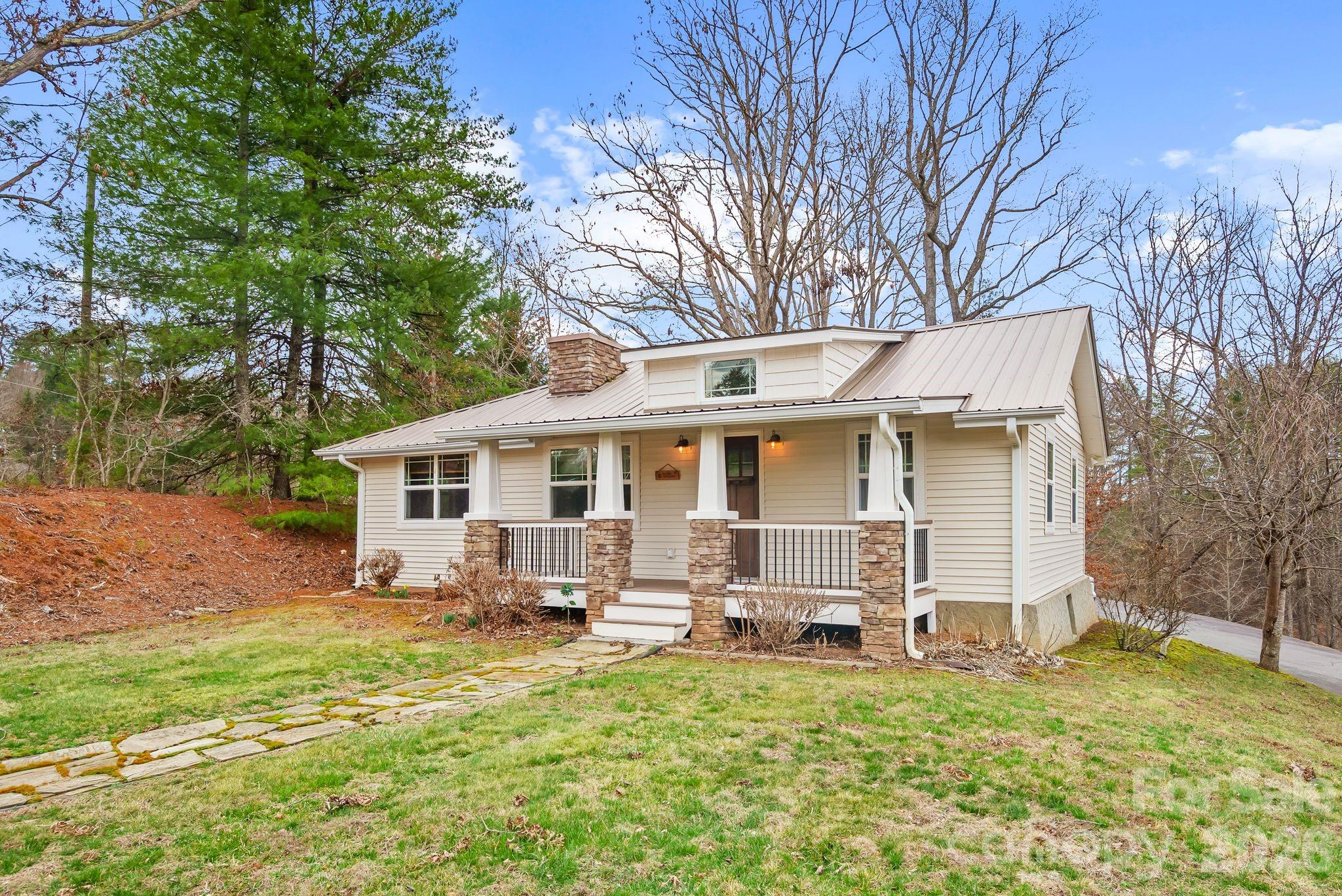 90 Palmer Ford Road Weaverville, NC 28787 - Photo 2 of 32 a house view with a outdoor space