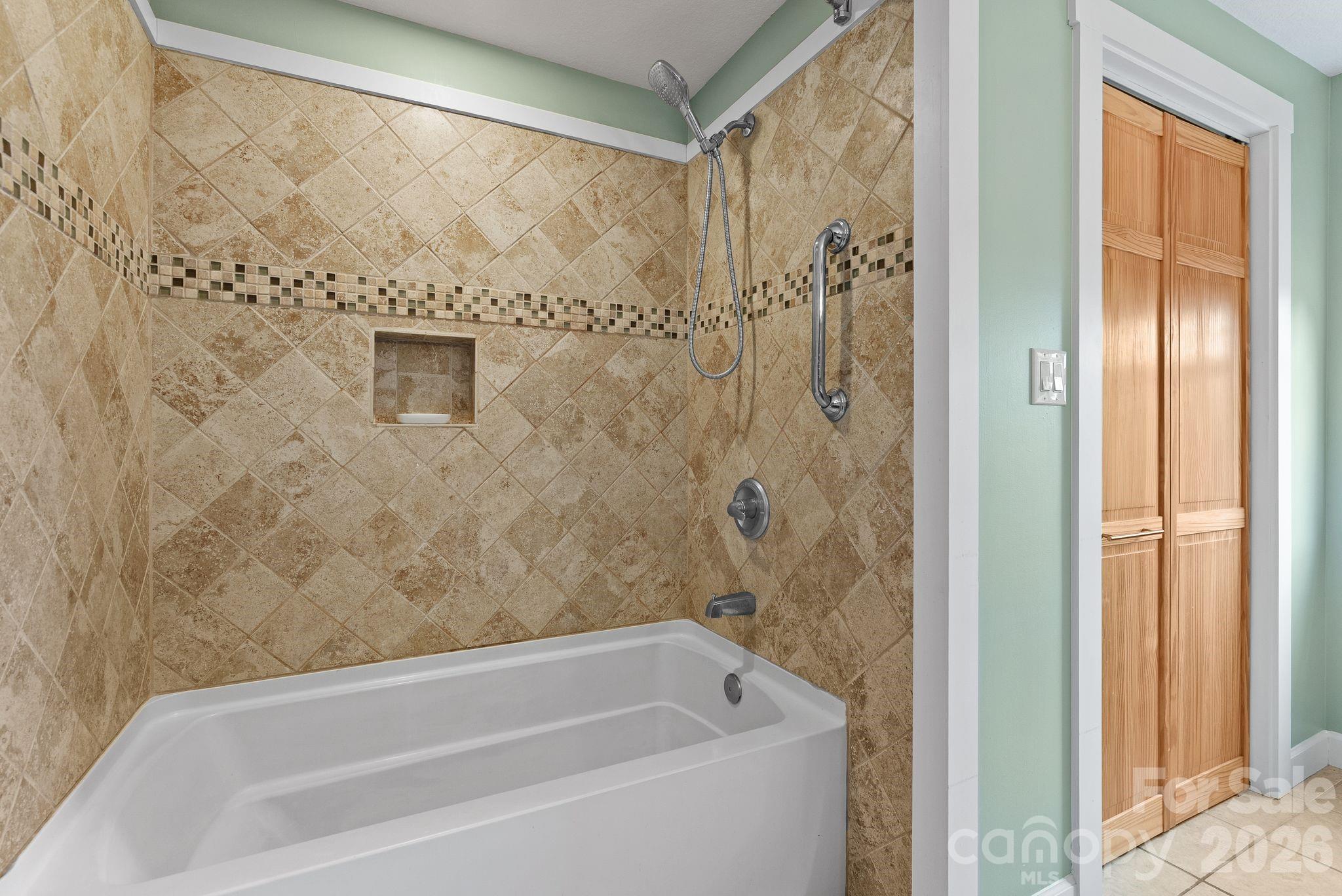90 Palmer Ford Road Weaverville, NC 28787 - Photo 21 of 32 a bathroom with a bathtub and shower