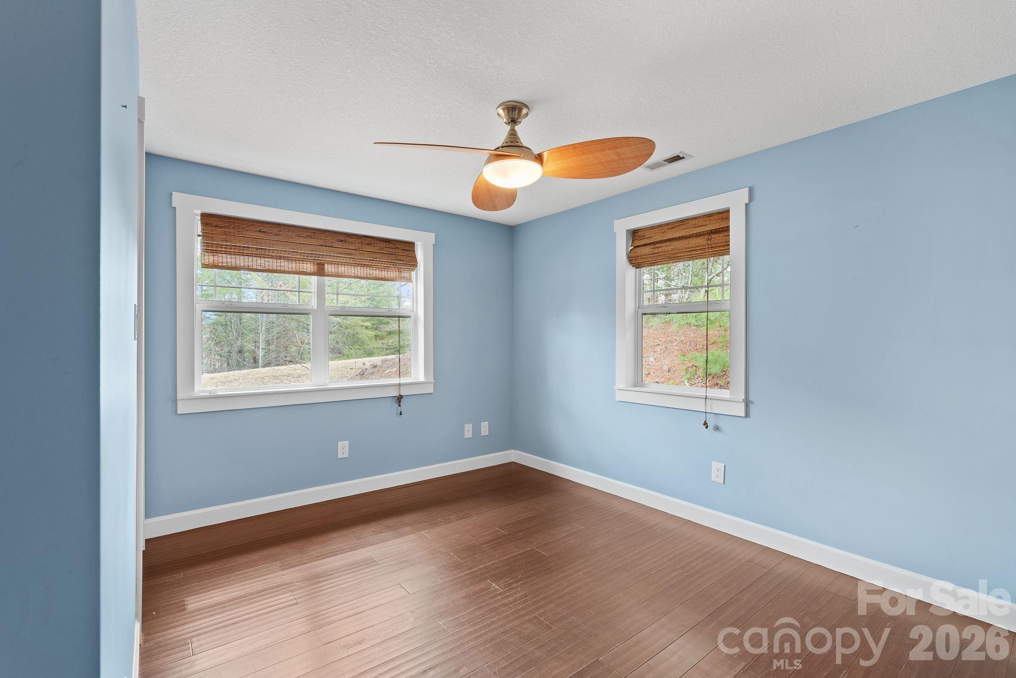 90 Palmer Ford Road Weaverville, NC 28787 - Photo 25 of 32 an empty room with window and wooden floor