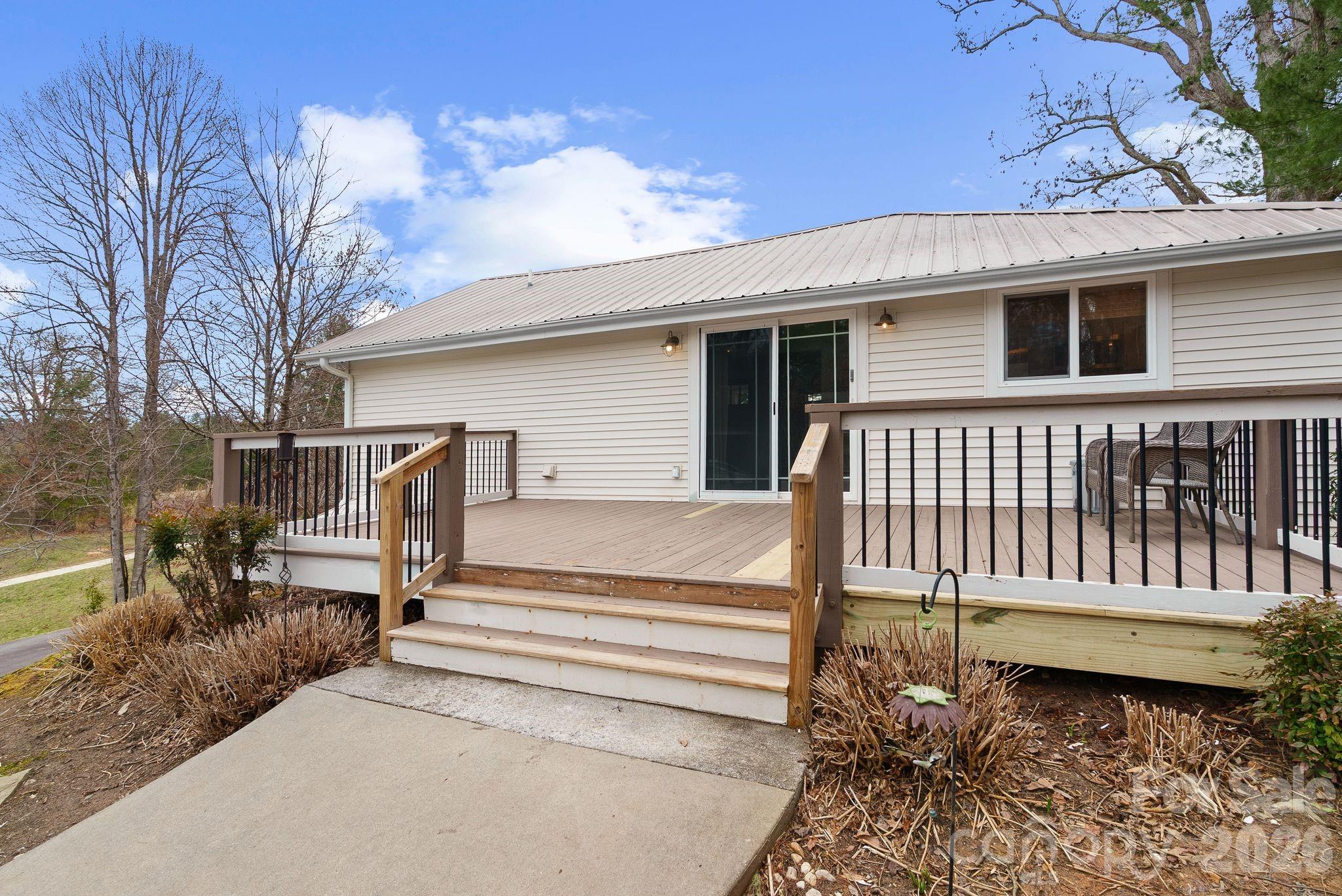 90 Palmer Ford Road Weaverville, NC 28787 - Photo 26 of 32 a front view of a house with a garden