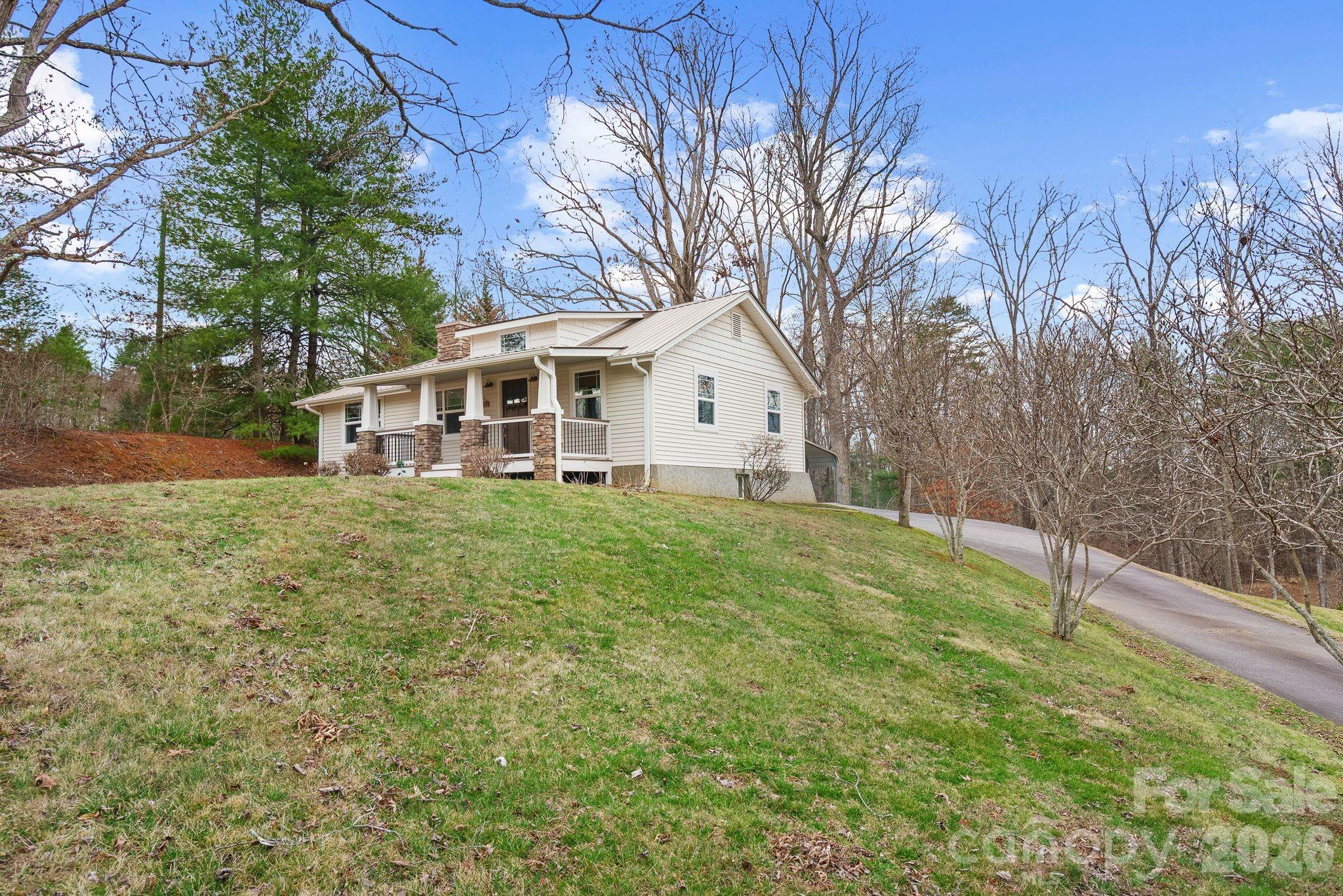 90 Palmer Ford Road Weaverville, NC 28787 - Photo 29 of 32 a view of a house with a yard and sitting area
