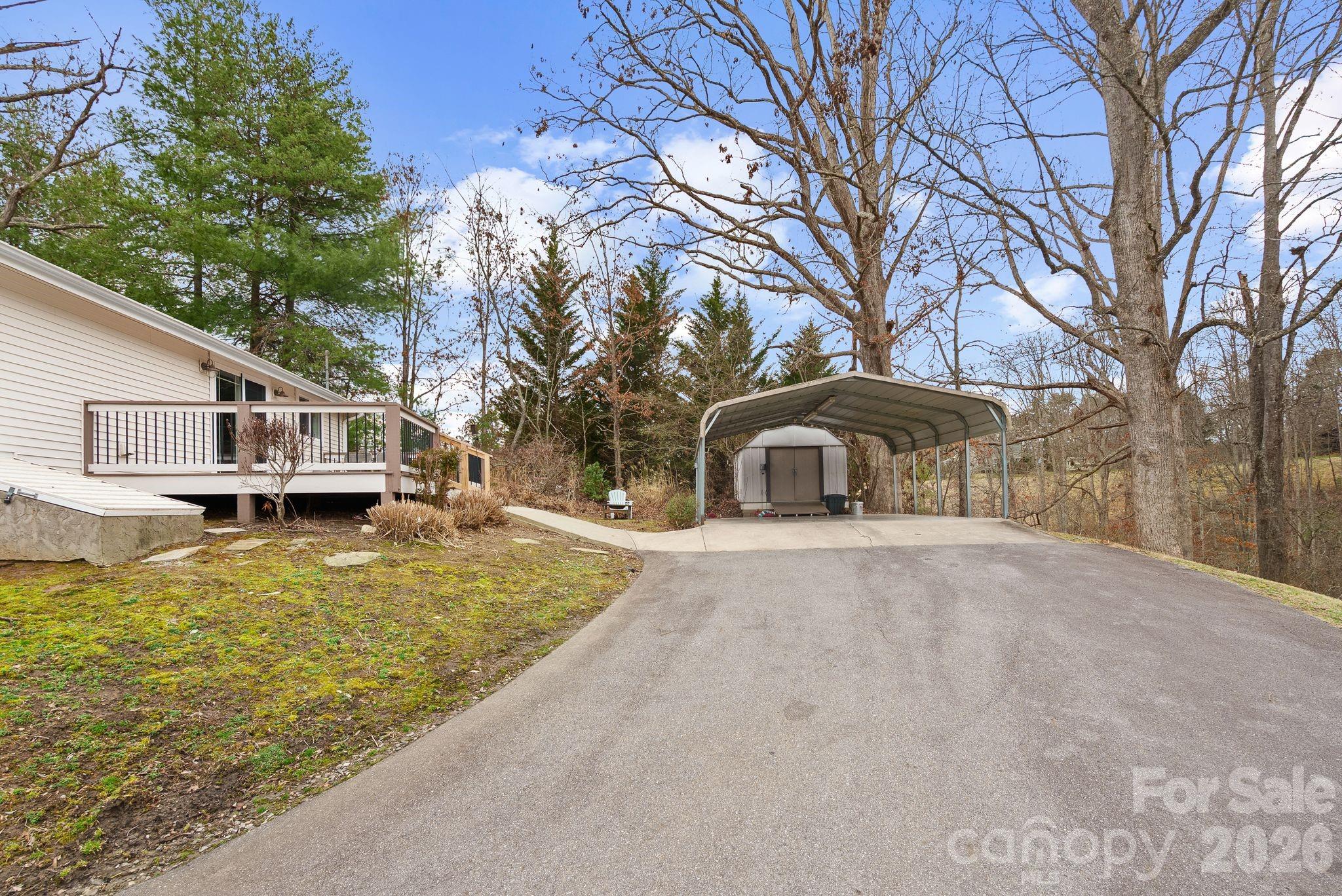 90 Palmer Ford Road Weaverville, NC 28787 - Photo 32 of 32 a front view of a house with a yard garage and trees