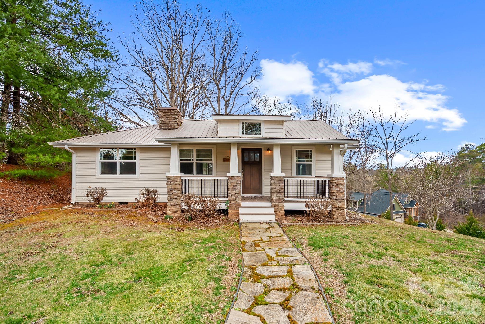 90 Palmer Ford Road Weaverville, NC 28787 - Photo 4 of 32 a front view of a house with a yard