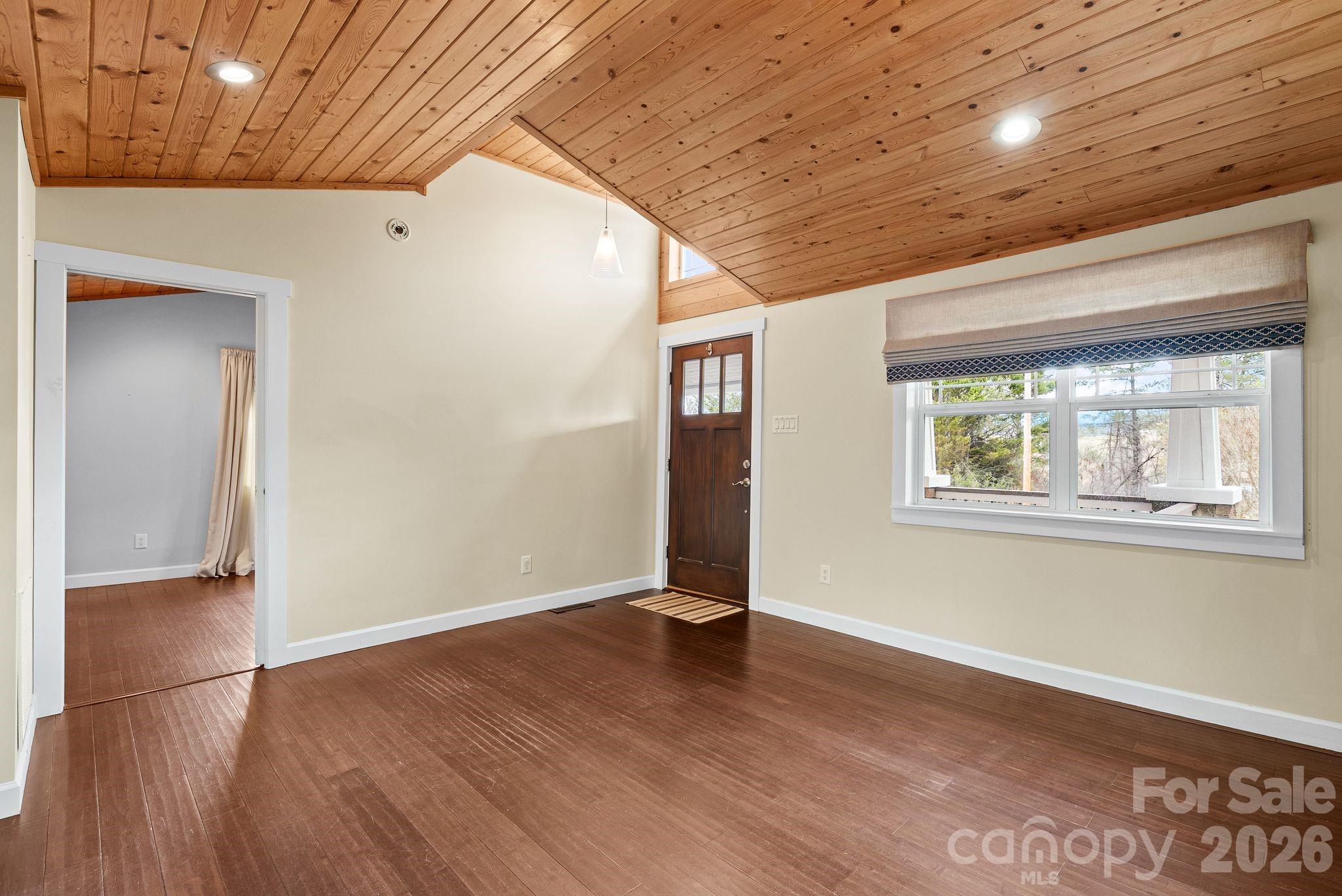 90 Palmer Ford Road Weaverville, NC 28787 - Photo 6 of 32 an empty room with wooden floor and windows