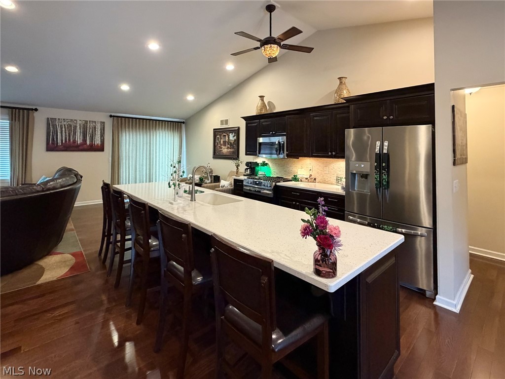 1343 Courtland Road Weirton, WV 26062 - Photo 7 of 50 Kitchen with a kitchen breakfast bar, stainless steel appliances, a spacious island, recessed lighting, and dark wood-style flooring