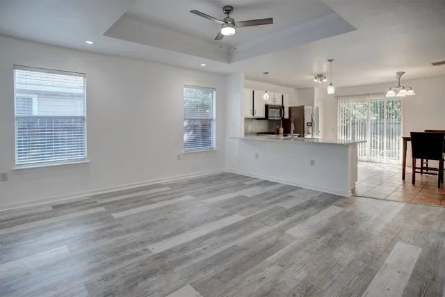 a view of a kitchen with a sink and a window