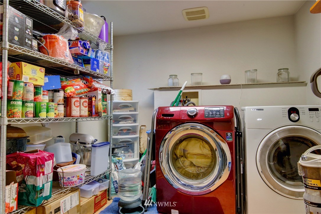 910 Cook Road Sedro-Woolley, WA 98284 - Photo 18 of 37 a utility room with dryer washer and a flat screen tv
