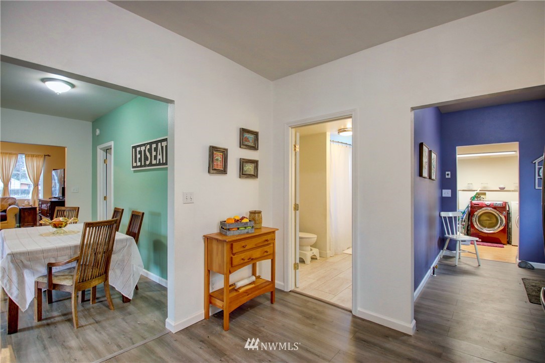 910 Cook Road Sedro-Woolley, WA 98284 - Photo 21 of 37 a view of a workspace with furniture and wooden floor
