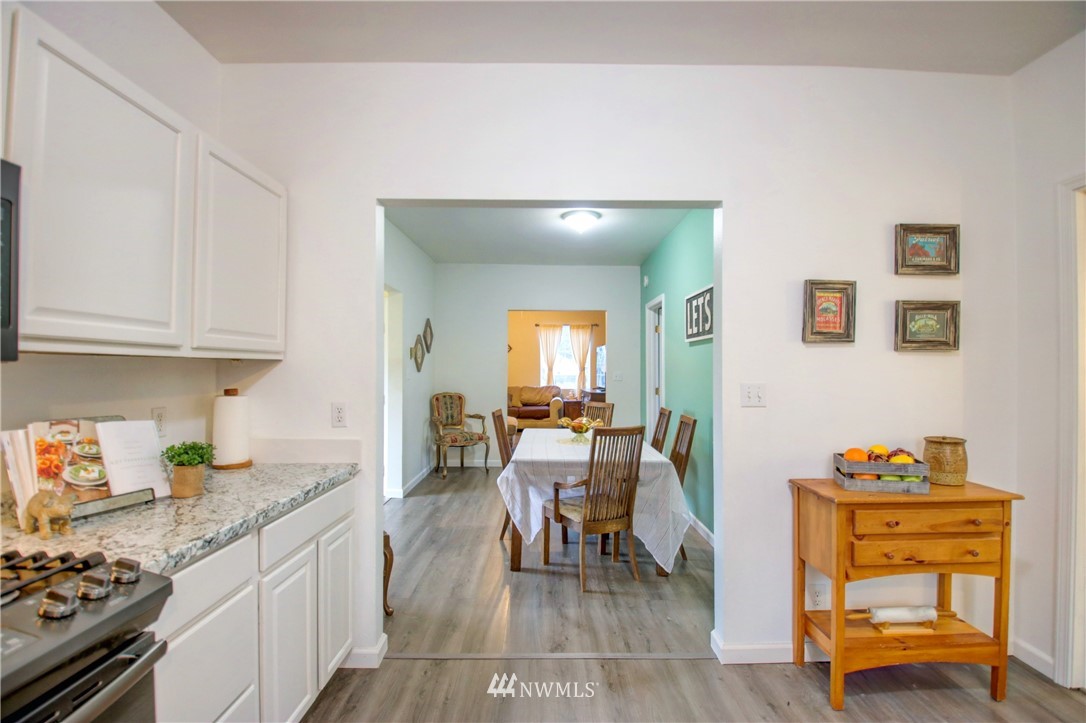 910 Cook Road Sedro-Woolley, WA 98284 - Photo 22 of 37 a kitchen with stainless steel appliances granite countertop a stove and a refrigerator