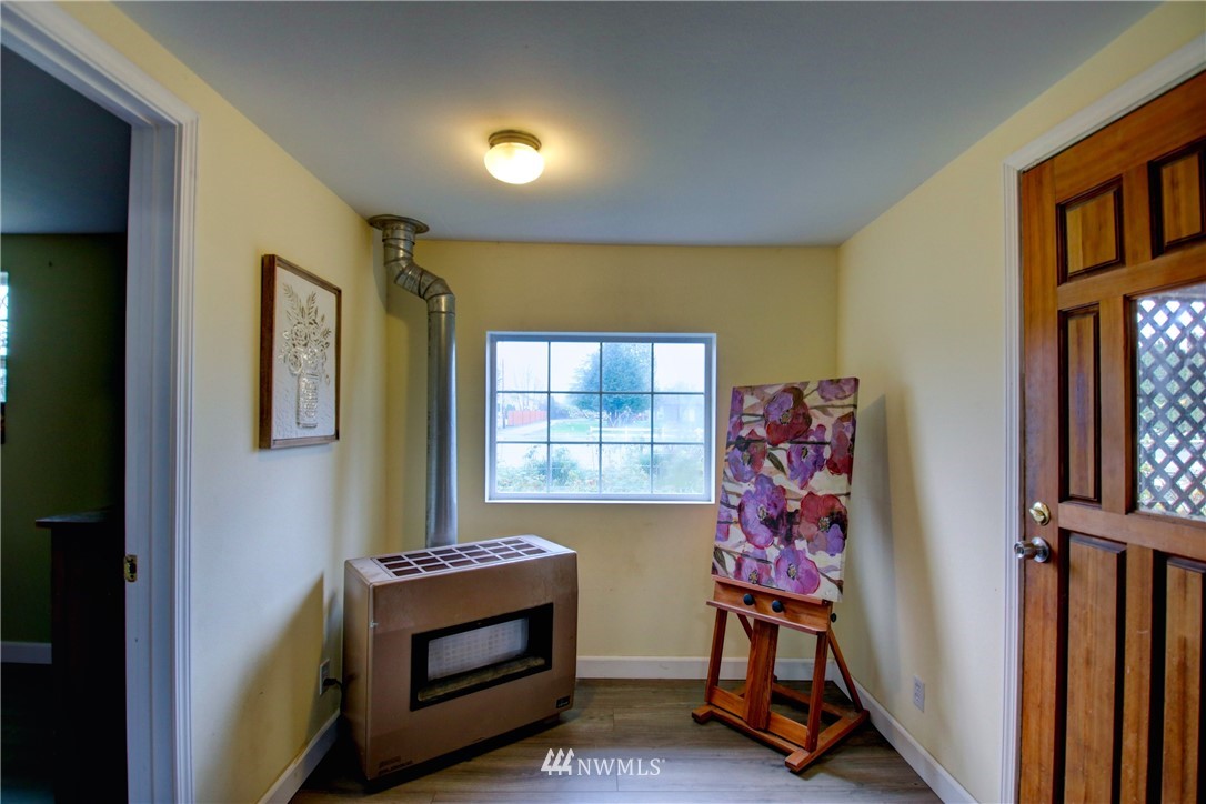 910 Cook Road Sedro-Woolley, WA 98284 - Photo 23 of 37 a bedroom with bed and a window