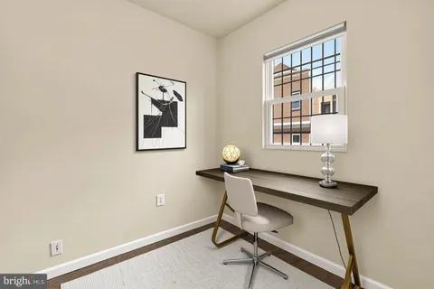 a view of a workspace with furniture