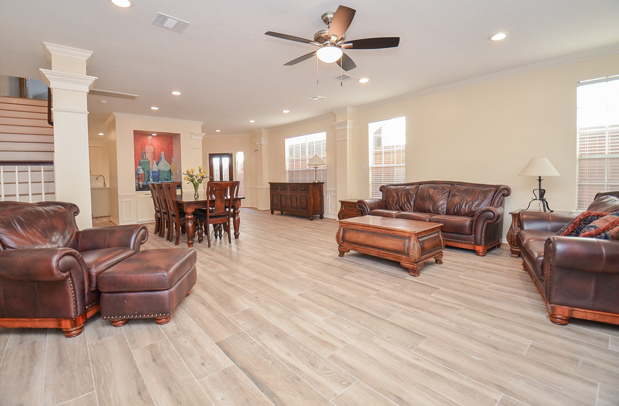 4916 Inker Street Houston, TX 77007 - Photo 15 of 36 Heading back into the home, note the ceiling fan, number of canisters lights, and casual yet elegant setting.