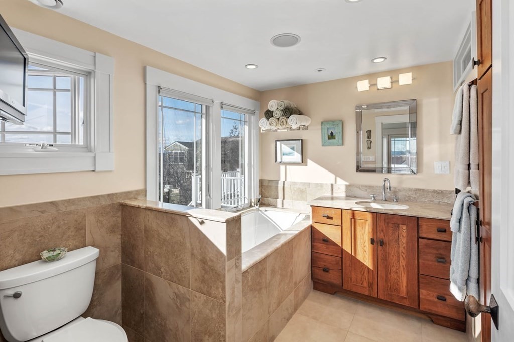 13 Beacon Road Hull, MA 02045 - Photo 18 of 41 a spacious bathroom with a granite countertop sink mirror and toilet